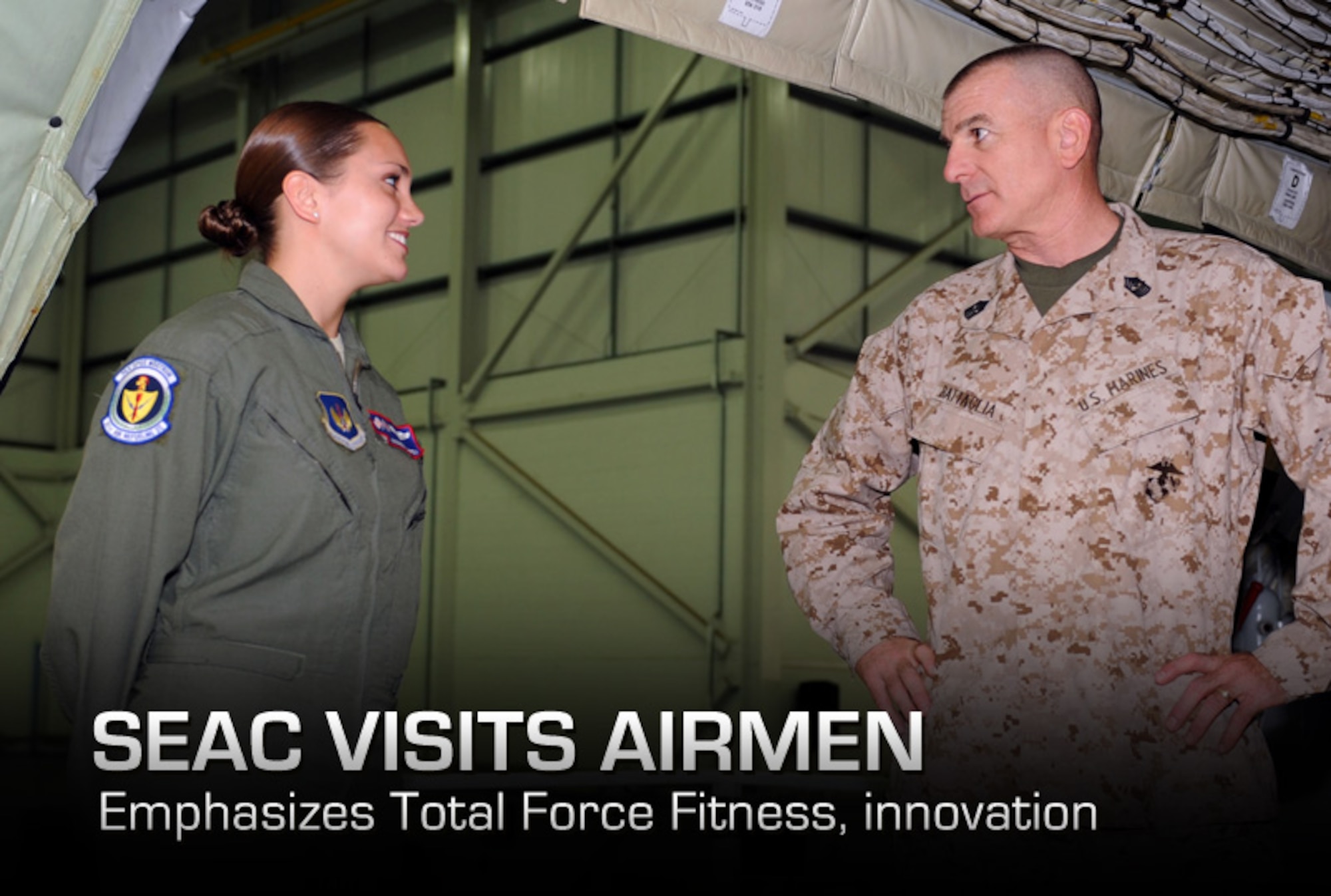 Senior Airman Amanda Ampey (left) meets Marine Corps Sgt. Maj. Bryan Battaglia before showing him the interior of a KC-135 Stratotanker June 20, 2013, at Hangar 814 during a tour of Royal Air Force Mildenhall, England. While on RAF Mildenhall, Battaglia also viewed 352nd Special Operations Group assets, and he addressed Airmen during a base town hall meeting. Battaglia is the senior enlisted advisor to the chairman of the Joint Chiefs of Staff. Ampey is a 351st Air Refueling Squadron boom operator. (U.S. Air Force photo/Airman 1st Class Preston Webb) 