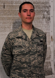 Airman Wade Fielder of Paso Robles, Calif., is a cyber transportation systems technician for the 744th Communications Group at Joint Base Andrews, Md. Fielder volunteered to be an usher at Secretary of the Air Force Michael B. Donley's farewell ceremony June 21, 2013. (U.S. Air Force photo/Staff Sgt. Torey Griffith)