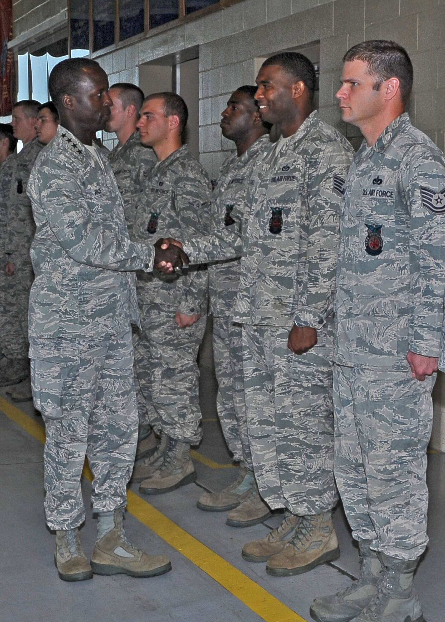 Gen. Edward A. Rice Jr., Commander, Air Education and Training Command, shakes the hand of Staff Sgt. Michael Satchell during his visit to the Fire Station June 18. After a warm welcome from the Airmen at the Fire Station, Rice spoke to junior enlisted Airmen about various topics, such as their reason for joining the military, at the junior enlisted meeting in the Fire Station. (U.S. Air Force Photo/Airman 1st Class Stephanie Englar)