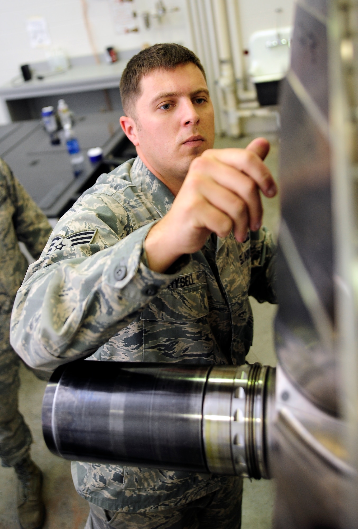 Staff Sgt. Brandon Hysell, from the 509th Aircraft Maintenance Squadron propulsion shop, loosens blades on a B-2 Spirit engine during a basic propulsion class at the 372nd Training Squadron, Det. 6, at Whiteman Air Force Base, Mo., June 14, 2013. Basic, continuation and advanced classes are offered to engine mechanics at different points throughout their careers. (U.S. Air Force photo by Staff Sgt. Brigitte N. Brantley/Released)