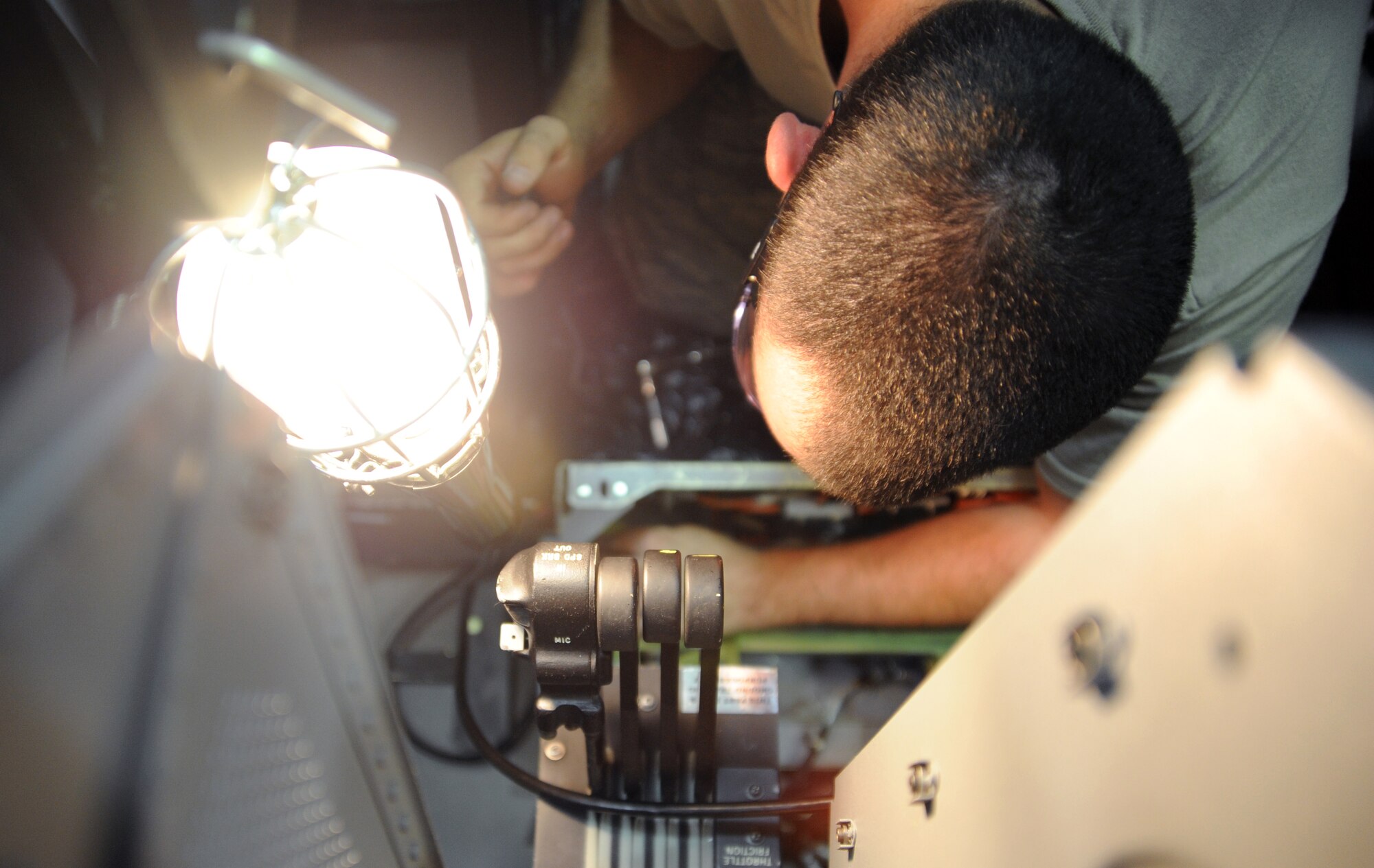Senior Airman John T. Eckardt, 372nd Training Squadron, Det. 6, B-2 Spirit instruments and flight controls instructor, demonstrates his ability to work on a pitch torque tube and pitch positioning sensor assembly at Whiteman Air Force Base, Mo., June 12, 2013. Once he is a fully qualified instructor, he will pass his knowledge on to Airmen new to the career field, as well as experienced Airmen from other airframes. (U.S. Air Force photo by Staff Sgt. Brigitte N. Brantley/Released)