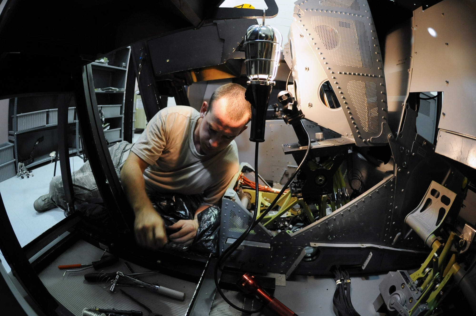 Senior Airman John T. Eckardt, 372nd Training Squadron, Det. 6, B-2 Spirit instruments and flight controls instructor, works on a pitch torque tube and pitch positioning sensor assembly at Whiteman Air Force Base, Mo., June 12, 2013. Being able to follow the maintenance process of this operation is just one of the many things Eckardt must demonstrate before being fully qualified as an instructor. (U.S. Air Force photo by Staff Sgt. Brigitte N. Brantley/Released)