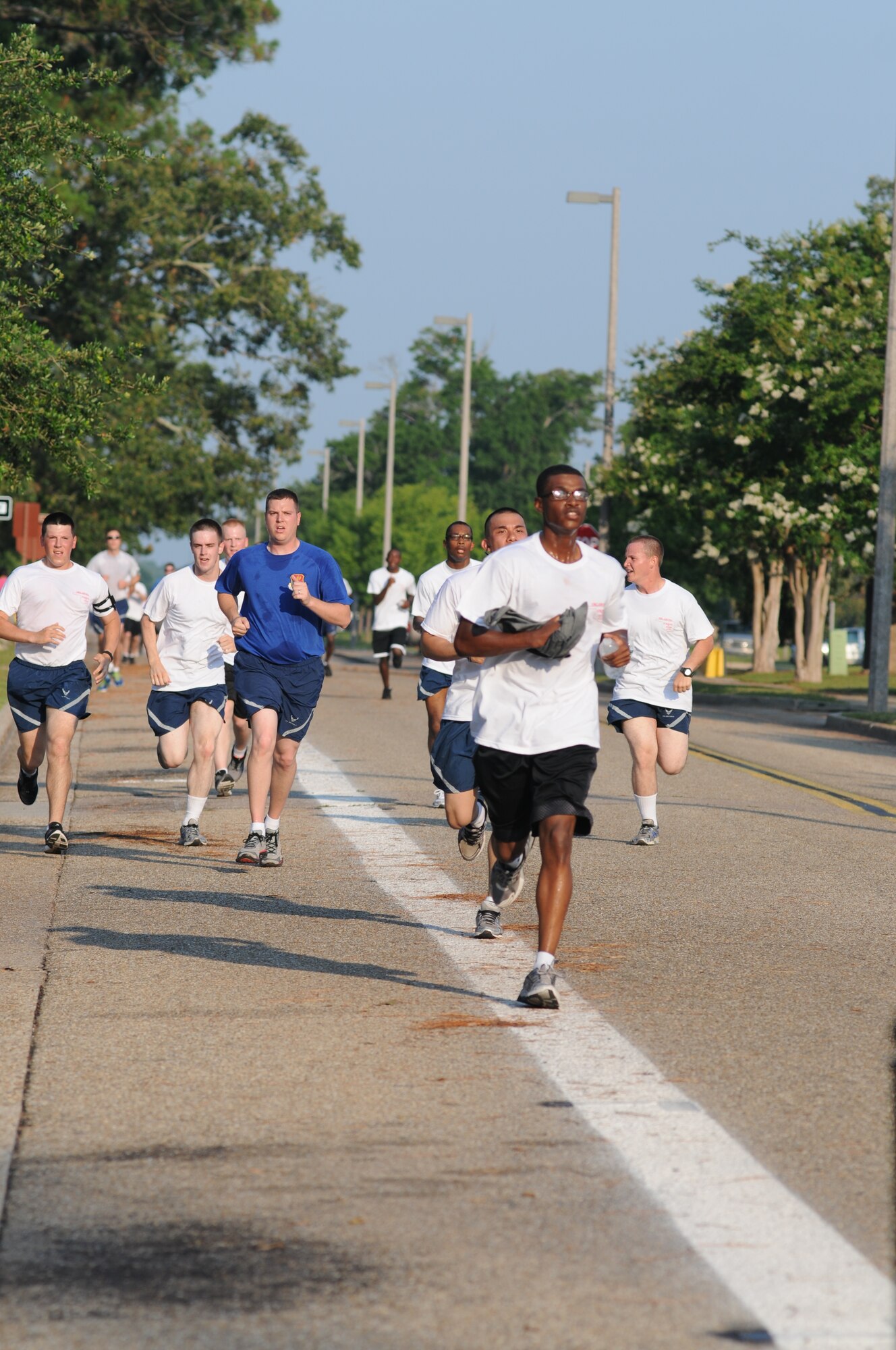 Keesler members participate in a 5K benefit run June 21, 2013, at Keesler Air Force Base, Miss., to show their support for Oklahoma tornado victims. More than 400 people pre-registered for the run and team Keesler raised more than $10,000 total to help aid in relief efforts.  (U.S. Air Force photo by Kemberly Groue)