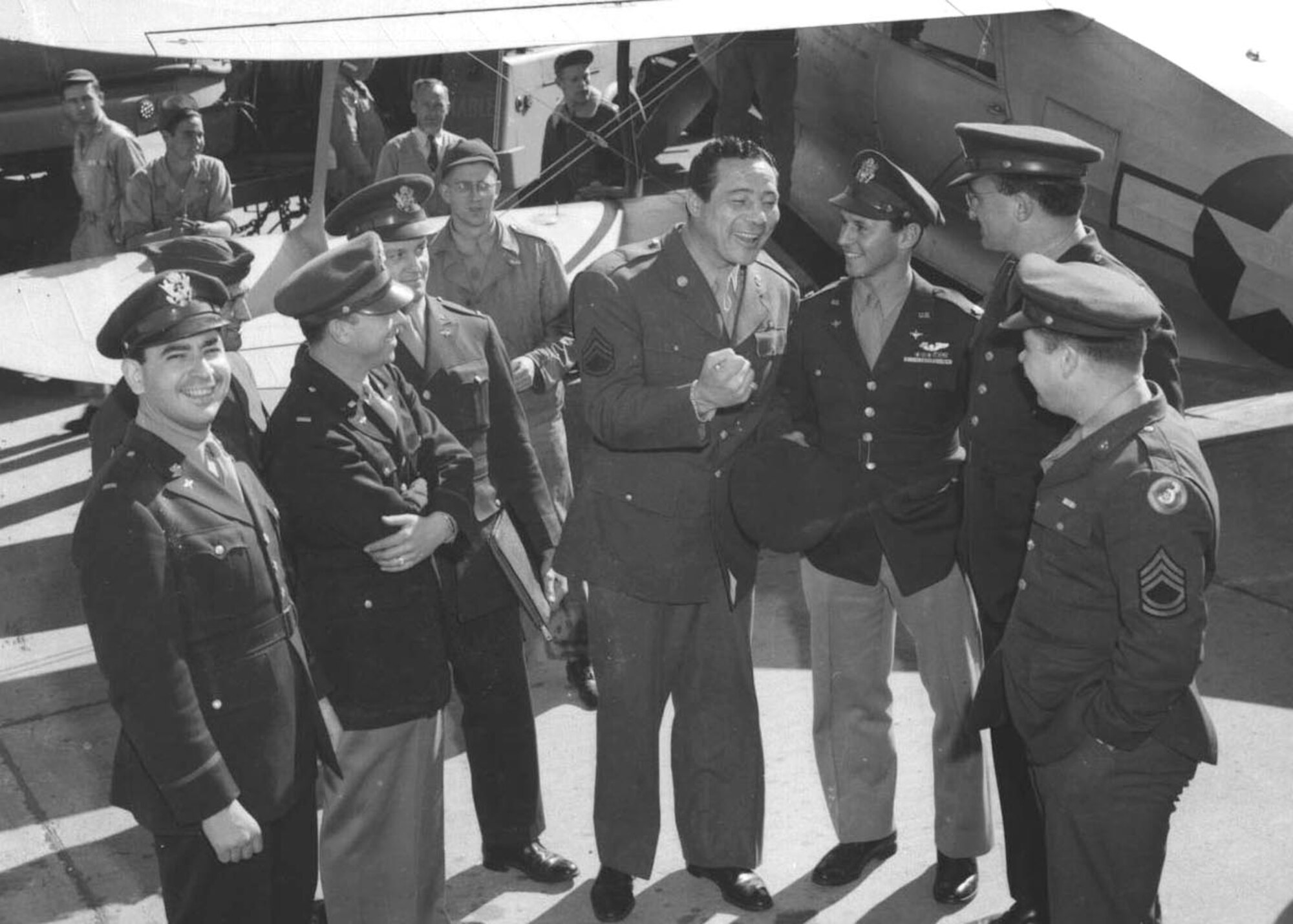 Staff Sgt. Max Baer (center), an American boxer of the 1930s, visits the 59th Fighter Group Army Air Corps on Thomasville Army Airfield, Ga. Baer was medically discarged in 1945 at Kelly Field, Texas after an 85 pound punching bag fell on him, injuring his neck and shoulder. (Courtesy photo)
