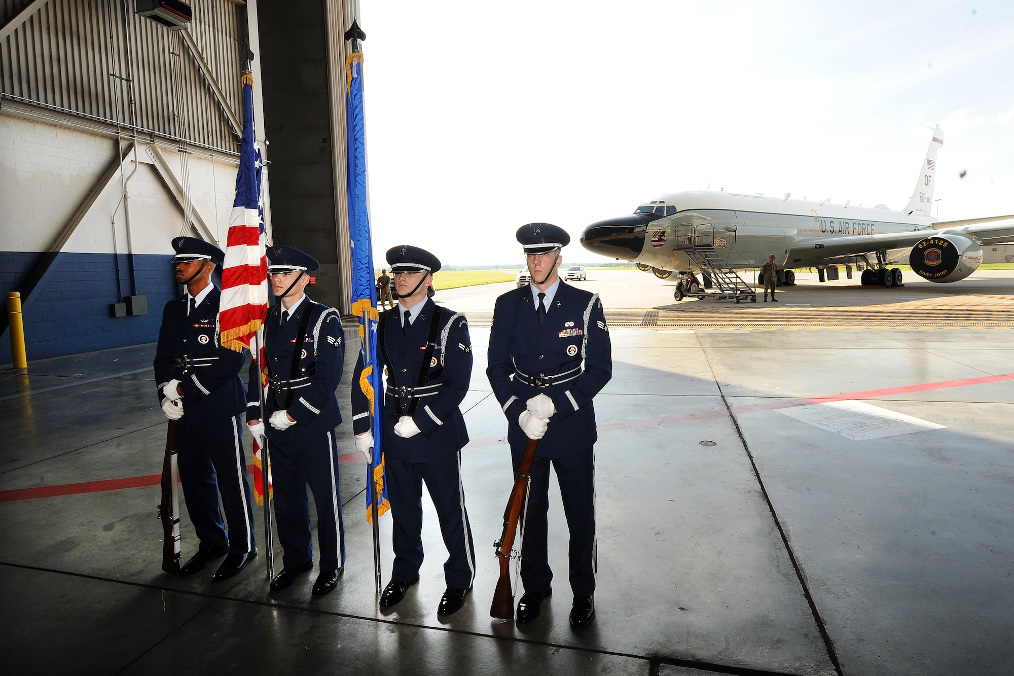 The Offutt Honor Guard stand in the Bennie Davis Maintenance Facility’s Dock 1 hangar, in front of the wing’s flagship aircraft, the RC-135 Rivet Joint, prior to the formal change of command ceremony on June 19, Offutt Air Force Base, Neb.  U.S. Air Force Lt. Gen. Robin Rand, 12th Air Force commander, presided over the change of command.  (U.S. Air Force photo by Josh Plueger/Released)