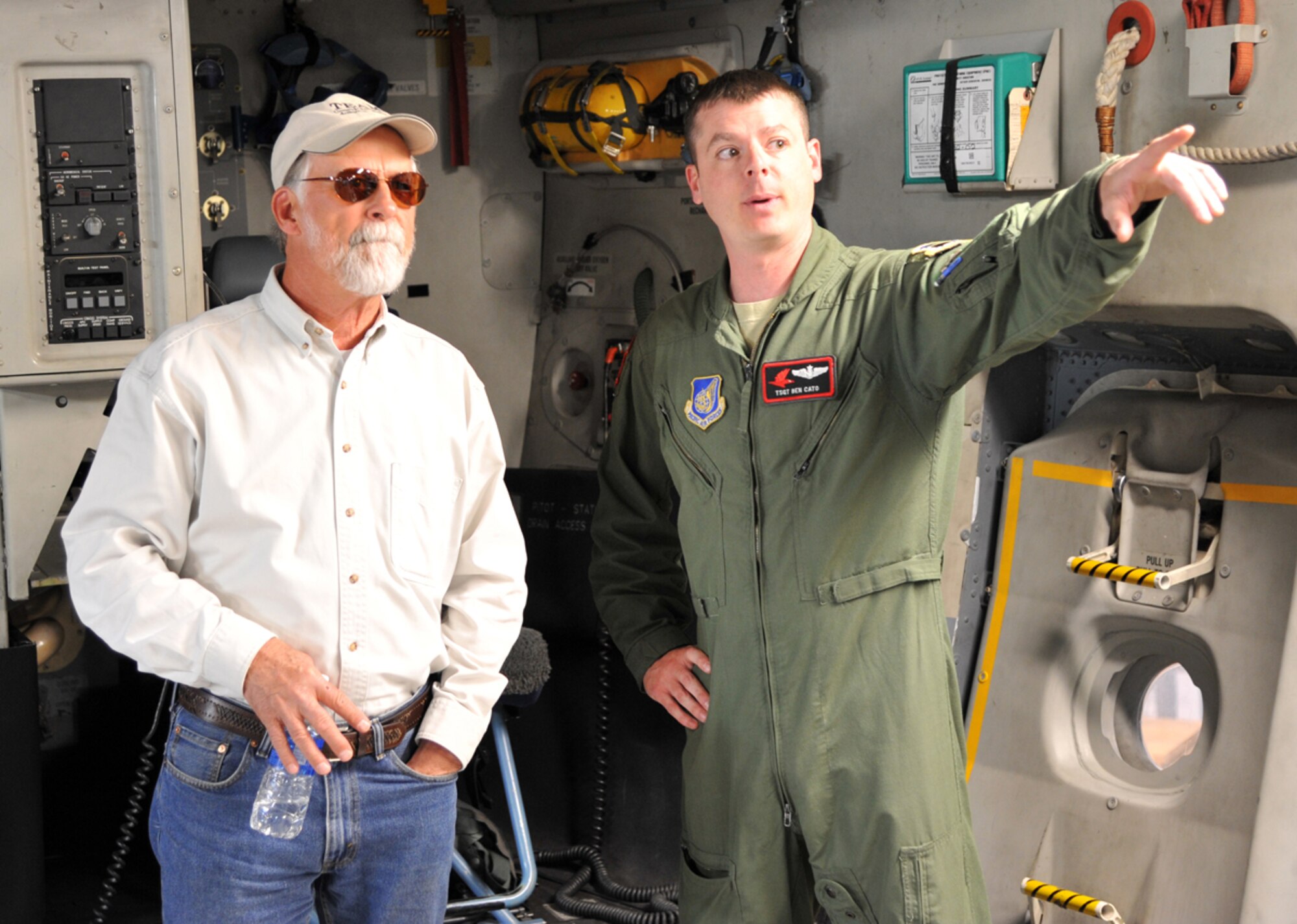 JOINT BASE ELMENDORF-RICHARDSON, Alaska -- Tech Sgt. Ben Cato, 517th Airlift Squadron, discusses aspects of the C-17 Globemaster III aircraft with Bill Prikryl, former fighter pilot with the 43rd Tactical Fighter Squadron, during a tour June 14. Members of the 43rd TFS reunited on Joint Base Elmendorf-Richardson, along with some of their family members, to commemorate the 43rd anniversary of the squadron being activated here. (U.S. Air Force photo/Senior Airman Blake Mize)