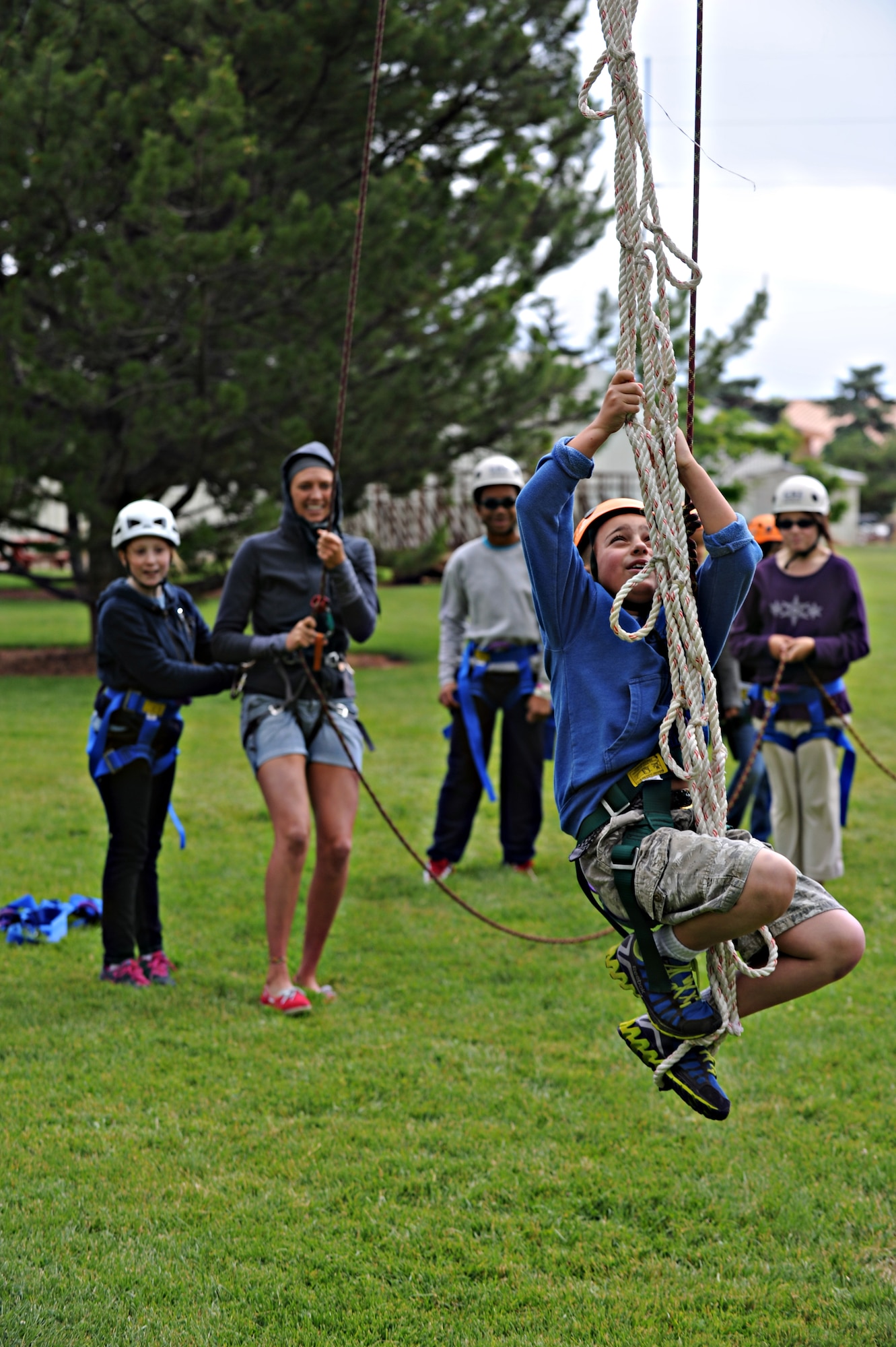 Dominic Schillaci is attempting to climb one of the 21 high element obstacles, June 19, 2013, at the College of Southern Idaho Challenge Course. Dominic was pushed mentally and physically, trying not to fear the heights while forcing himself to make it to the top. (U.S. Air Force photo by Airman 1st Class Brittany A. Chase/Released)