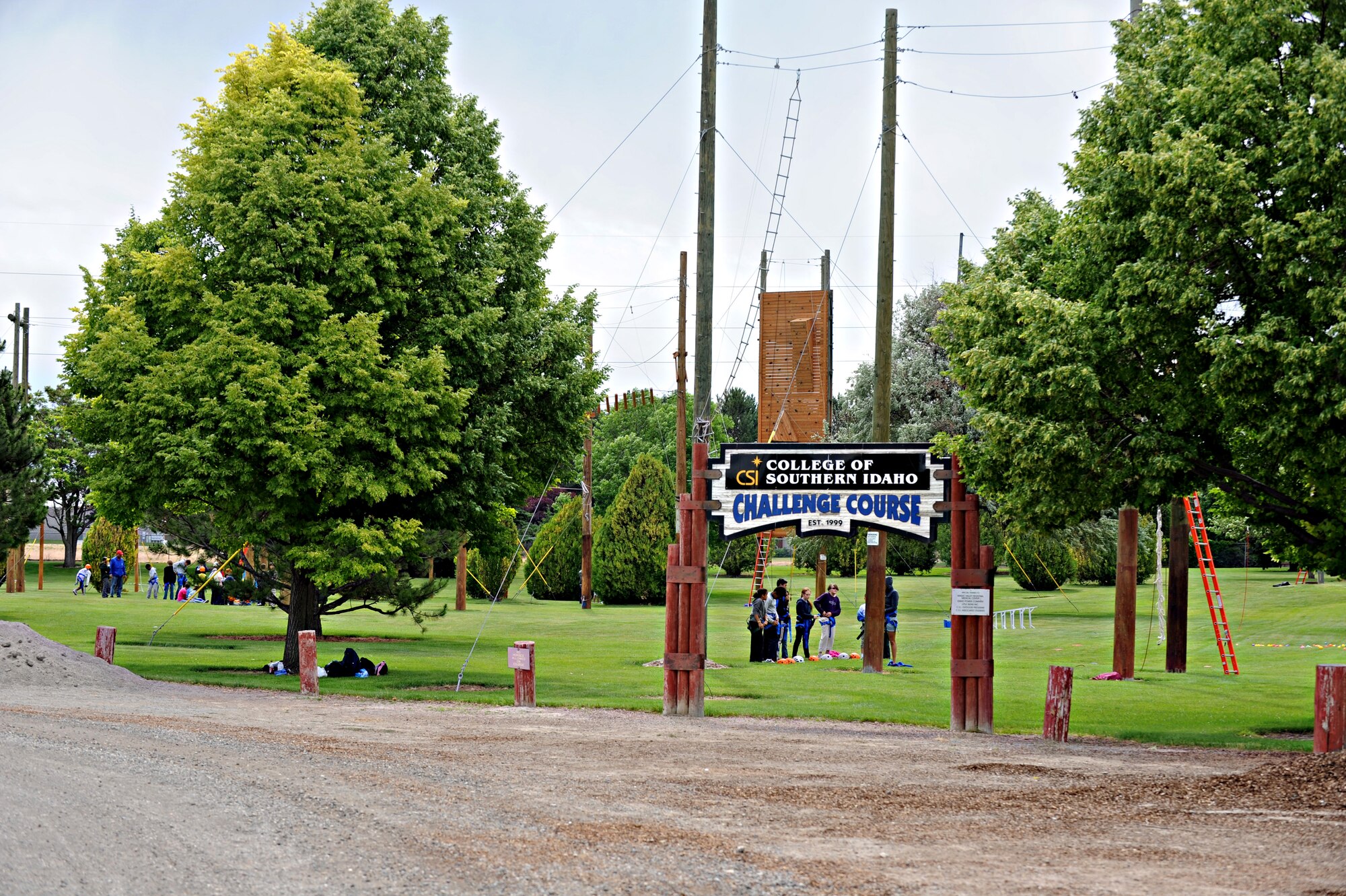 Children from Mountain Home Air Force Base, Idaho, prepare to take on the high-rope obstacles, June 19, 2013, at the College of Southern Idaho Challenge course. The Youth Center and CSI partnered up to allow the children to participate and push their limits in the CSI Challenge Course. (U.S. Air Force photo by Airman 1st Class Brittany A. Chase/Released)