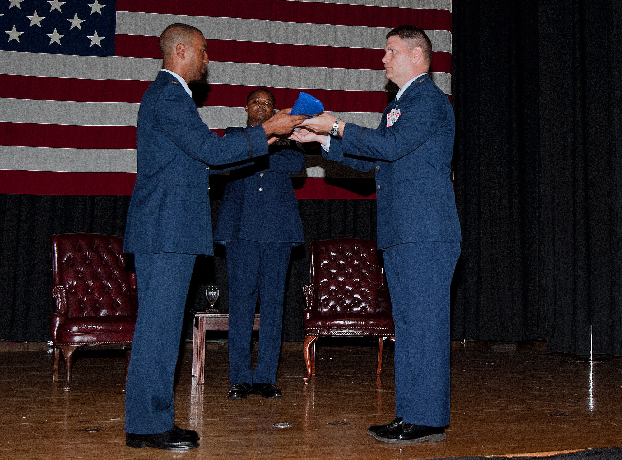 (Left to Right) Col. Eric Faison, 22nd Maintenance Group commander, and Maj. Dale Williquette, former 22nd Maintenance Operations Squadron commander, encase the 22nd MOS guidon symbolizing its inactivation June 19, 2013 at McConnell Air Force Base, Kan. The squadron’s inactivation was in line with an Air Force-wide effort to rebalance the maintenance officer career field and place officers into proper positions. (U.S. Air Force photo/Airman 1st Class Colby L. Hardin)