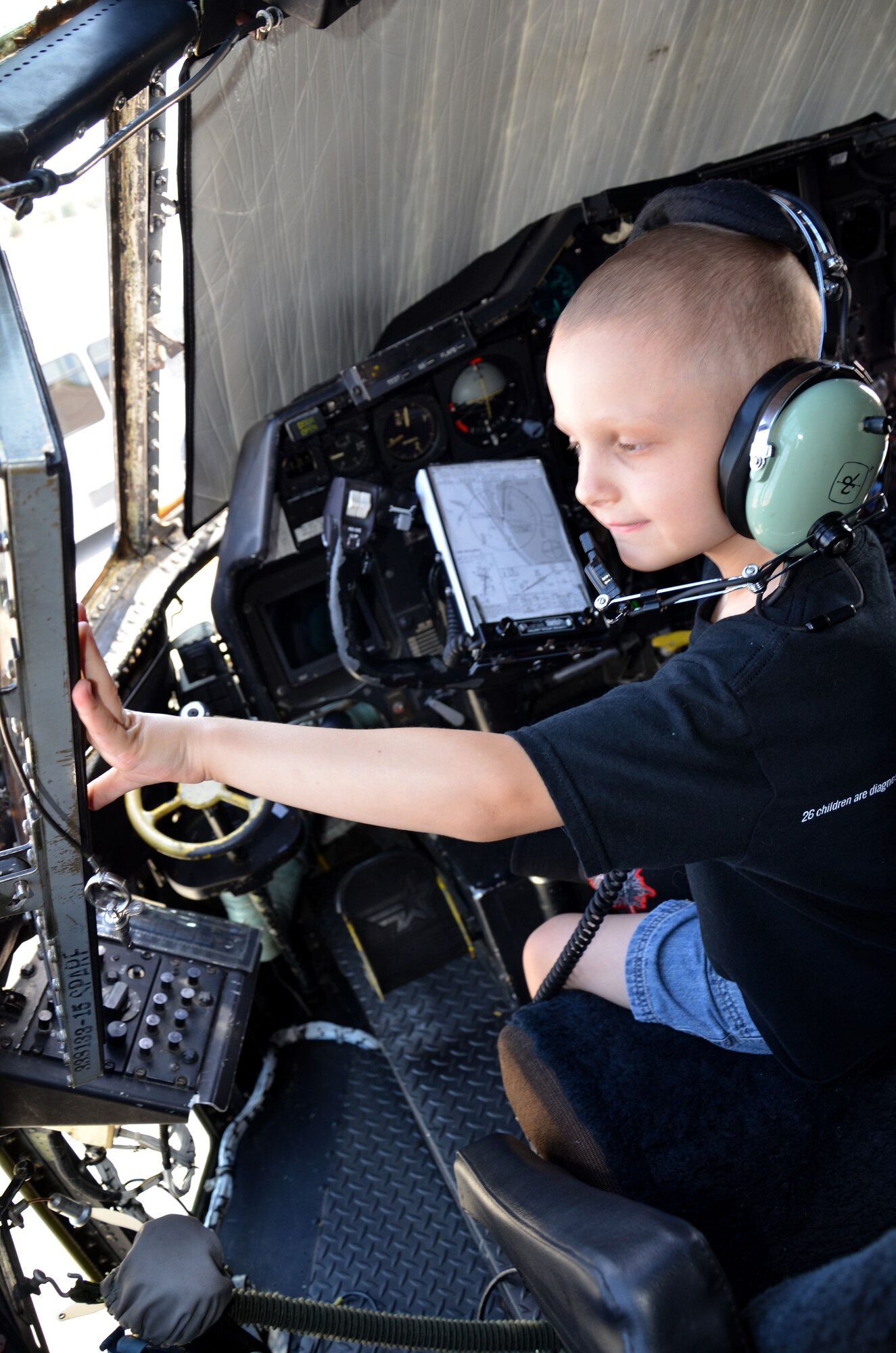 Trevor Scheerer, 5, checks out the flight deck of the 920th Rescue Wing's HC-130P/N King tanker aircraft during a visit to the 920th Rescue Wing, Cocoa Beach, Fla., to learn about combat search and rescue and meet the rescue professionals.  Scheerer and his family were invited by the Gerts family, who live on Patrick Air Force Base. These families are connected by cancer. Finnian Gerts, 7, is also battling the disease. The boys and their families met while in treatment at Arnold Palmer Hospital in Orlando, Fla. They were treated to a day they would never forget - tours of both rescue aircraft, the King and HH-60G Pave Hawk helicopters, and then finished with a "rescue mission" hosted by the pararescuemen here. (U.S. Air Force photo/2nd Lt. Leslie Forshaw)
