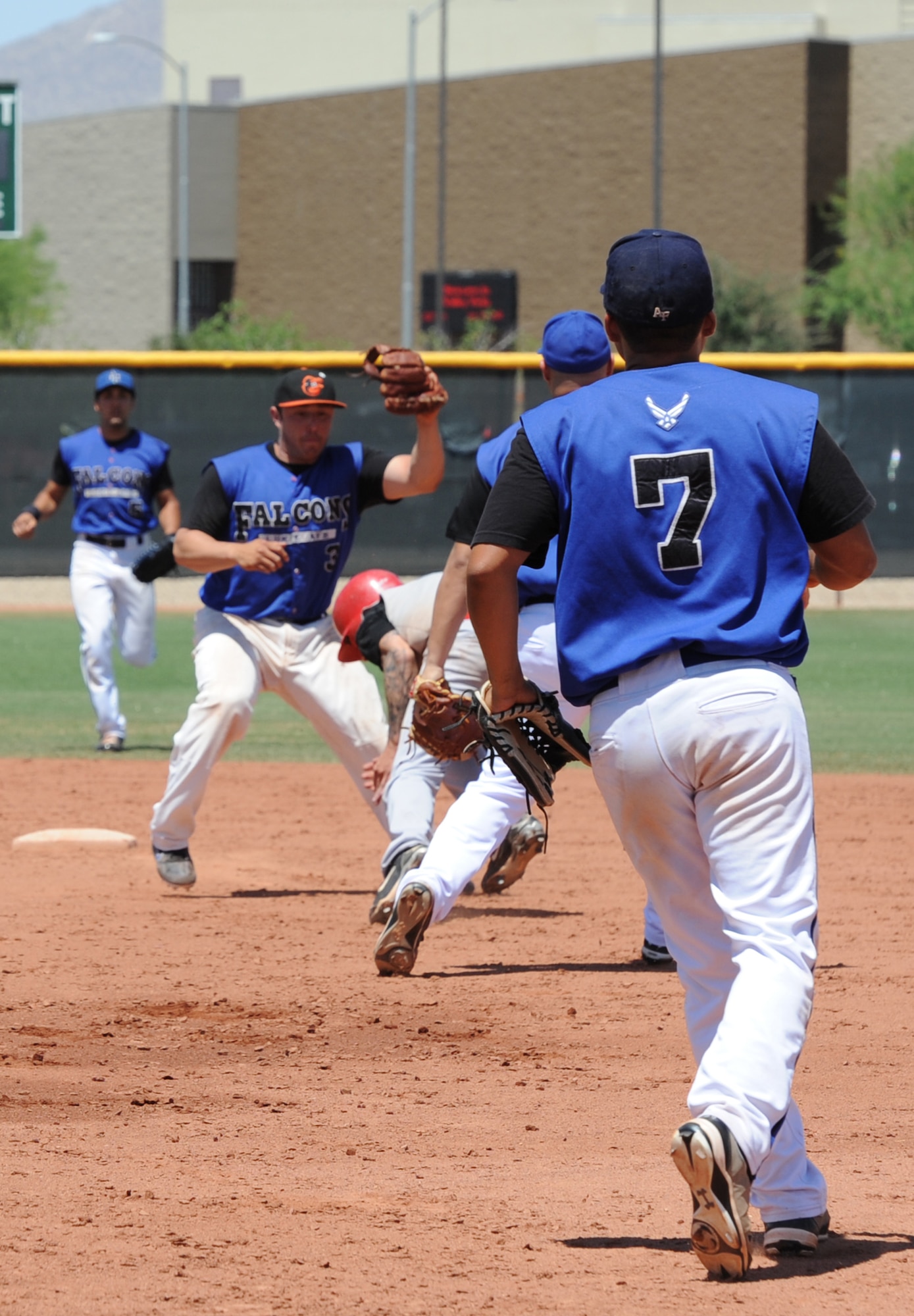 The Luke Air Force Base Falcons dove onto the diamond Sunday against the Peoria Bushwhackers in the Surprise league baseball championship at the Surprise Sports Complex baseball field. (U.S. Air Force photo/Airman 1st Class Pedro Mota)
