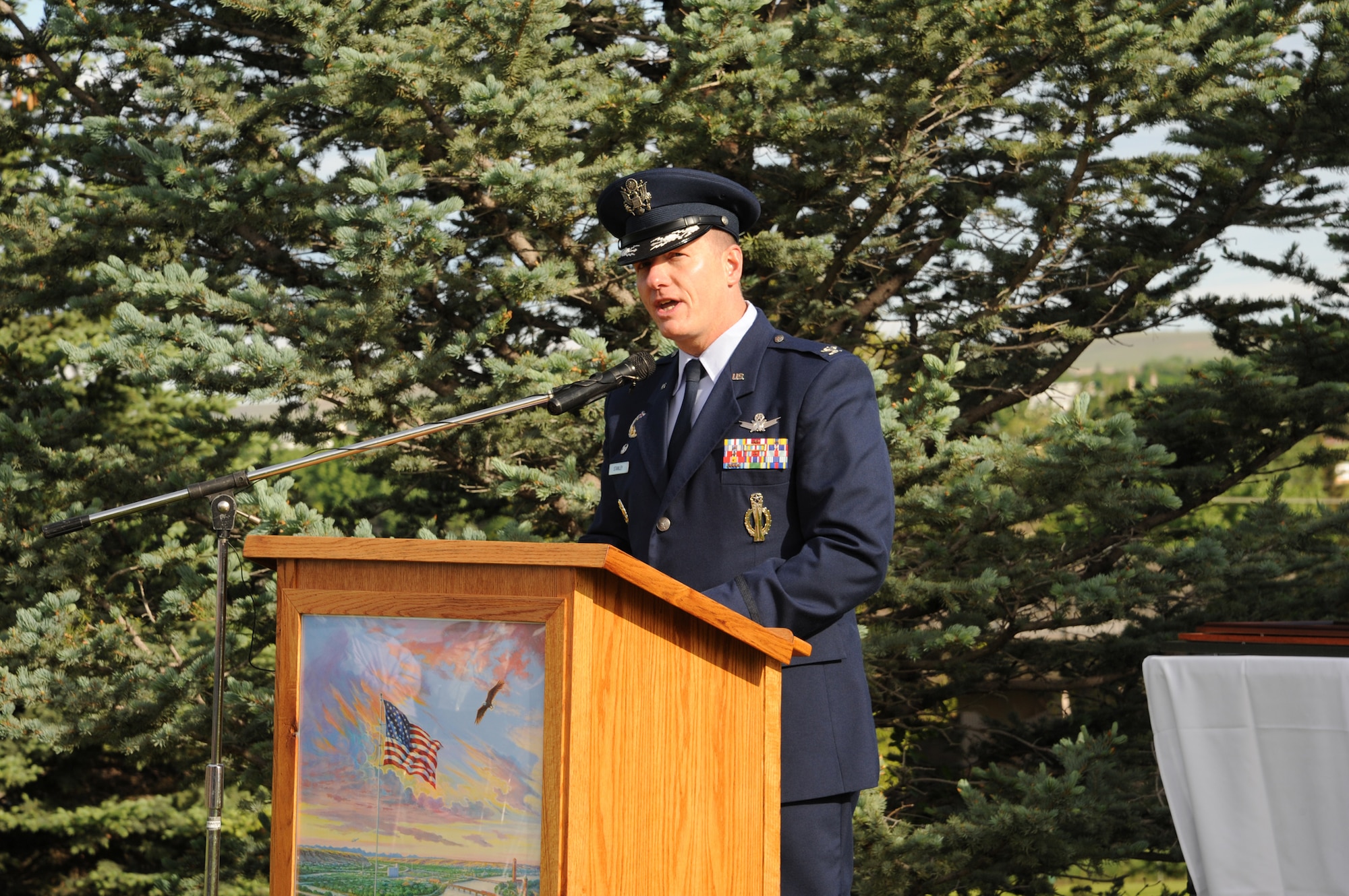 Col. Robert Stanley, 341st Missile Wing commander, speaks to members of the Montana Air National Guard, Team Malmstrom members and the Great Falls community during a celebration of National Flag Day at Broadwater Overlook Park in Great Falls on June 14. Kari Kent, retired Air Force chief master sergeant, and retired Army Brig. Gen. John Walsh, lieutenant governor of Montana, were also guest speakers at the event. (U.S. Air Force photo/Senior Airman Katrina Heikkinen) 