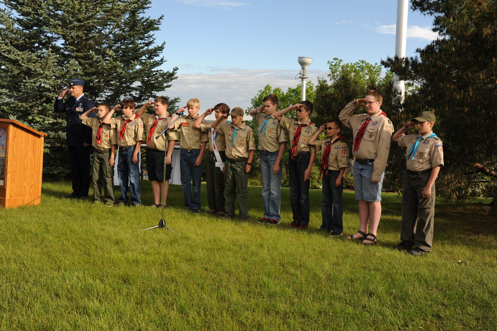 Maj. Rick Anderson, 120th Fighter Wing director of Equal Opportunity, stands for the pledge of allegiance alongside members of the Lewis and Clark district Boy Scouts during a Flag Day ceremony at Broadwater Overlook Park on June 14. Members of Team Malmstrom, the Great Falls community and MTANG came together to celebrate the national holiday. (U.S. Air Force photo/Senior Airman Katrina Heikkinen)