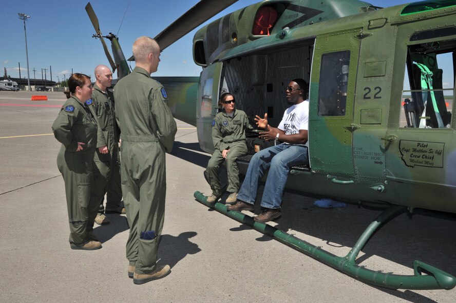 Devon Harris, a retired Jamaican army captain and member of the first Jamaican bobsled team, talks to members of the 40th Helicopter Squadron about achieving his goals of joining the Jamaican army and participating in the Olympics.  Harris was able to tour the helicopter squadron as well as attend a pre-departure briefing and see various equipment Airmen of Team Malmstrom use on a daily basis.  (U.S. Air Force photo/John Turner)