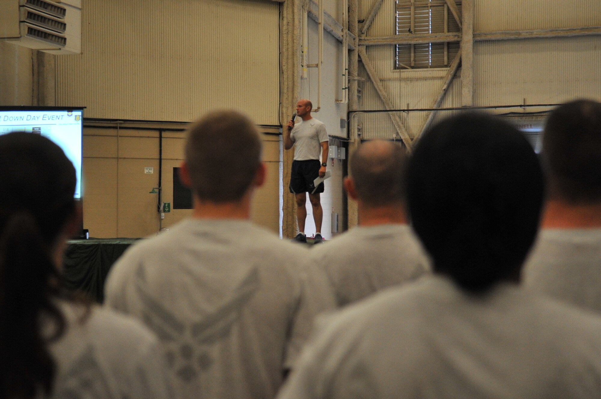 ALTUS AIR FORCE BASE, Okla. – Col. Anthony Krawietz, 97th Air Mobility Wing commander, speaks to base personnel about a climate of respect and combating sexist behaviors, harassment and assault during an all-call on base, June 21. The all-call was mandated by the Secretary of Defense to engage personnel in awareness and prevention of sexual assault. (U.S. Air Force photo by Senior Airman Dillon Davis/Released)