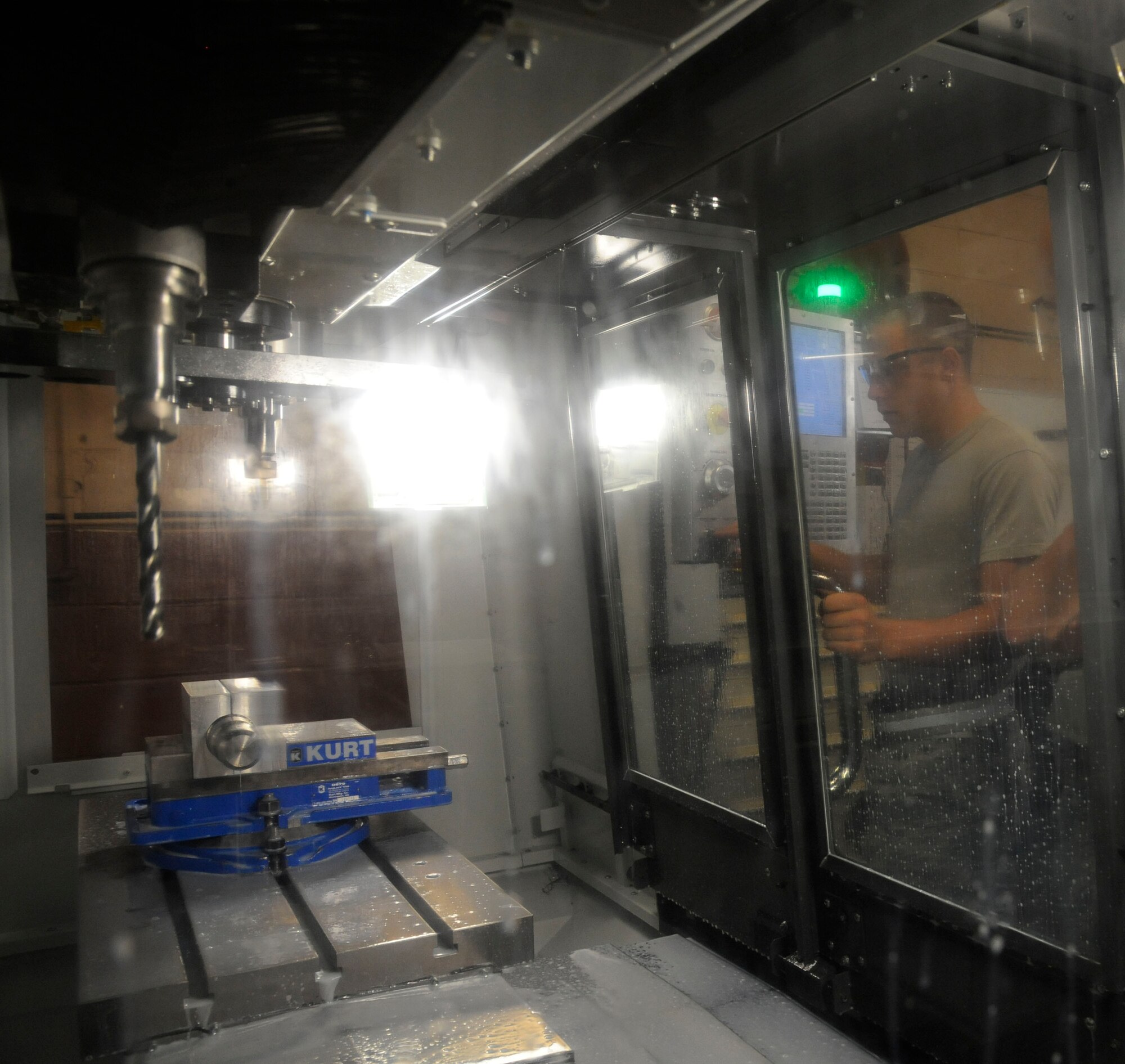 Airman 1st Class David Reid, from the 2nd Maintenance Squadron Fabrication Flight, prepares to create a sniper pod lug on Barksdale Air Force Base, La., June 20, 2013. The lugs are used to attach targeting pods to B-52H Stratofortress bombers. (U.S. Air Force photo/Airman 1st Class Andrew Moua)