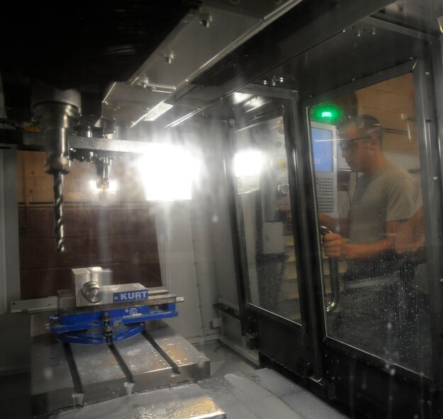 Airman 1st Class David Reid, from the 2nd Maintenance Squadron Fabrication Flight, prepares to create a sniper pod lug on Barksdale Air Force Base, La., June 20, 2013. The lugs are used to attach targeting pods to B-52H Stratofortress bombers. (U.S. Air Force photo/Airman 1st Class Andrew Moua)