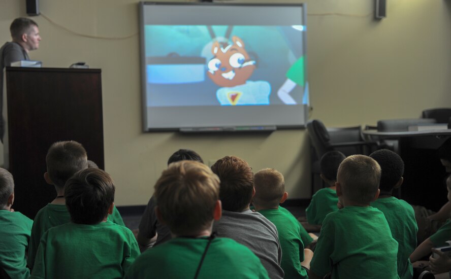 Children watch a movie during Vacation Bible School at Moody Air Force Base, Ga., June 14, 2013. Watching a movie is just one of the activities that the children participated in throughout the week. (U.S. Air Force photo by Airman Alexis Grotz/Released)
