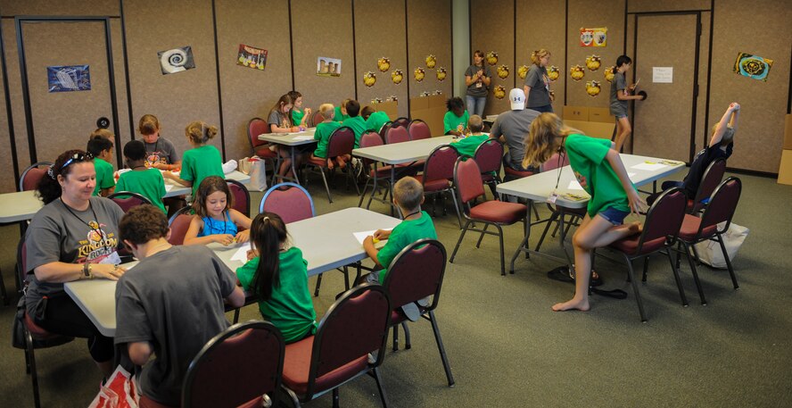 Children color pictures during Vacation Bible School (VBS) at Moody Air Force Base, Ga., June 14, 2013. VBS was geared toward elementary-age children. (U.S. Air Force photo by Airman Alexis Grotz/Released)