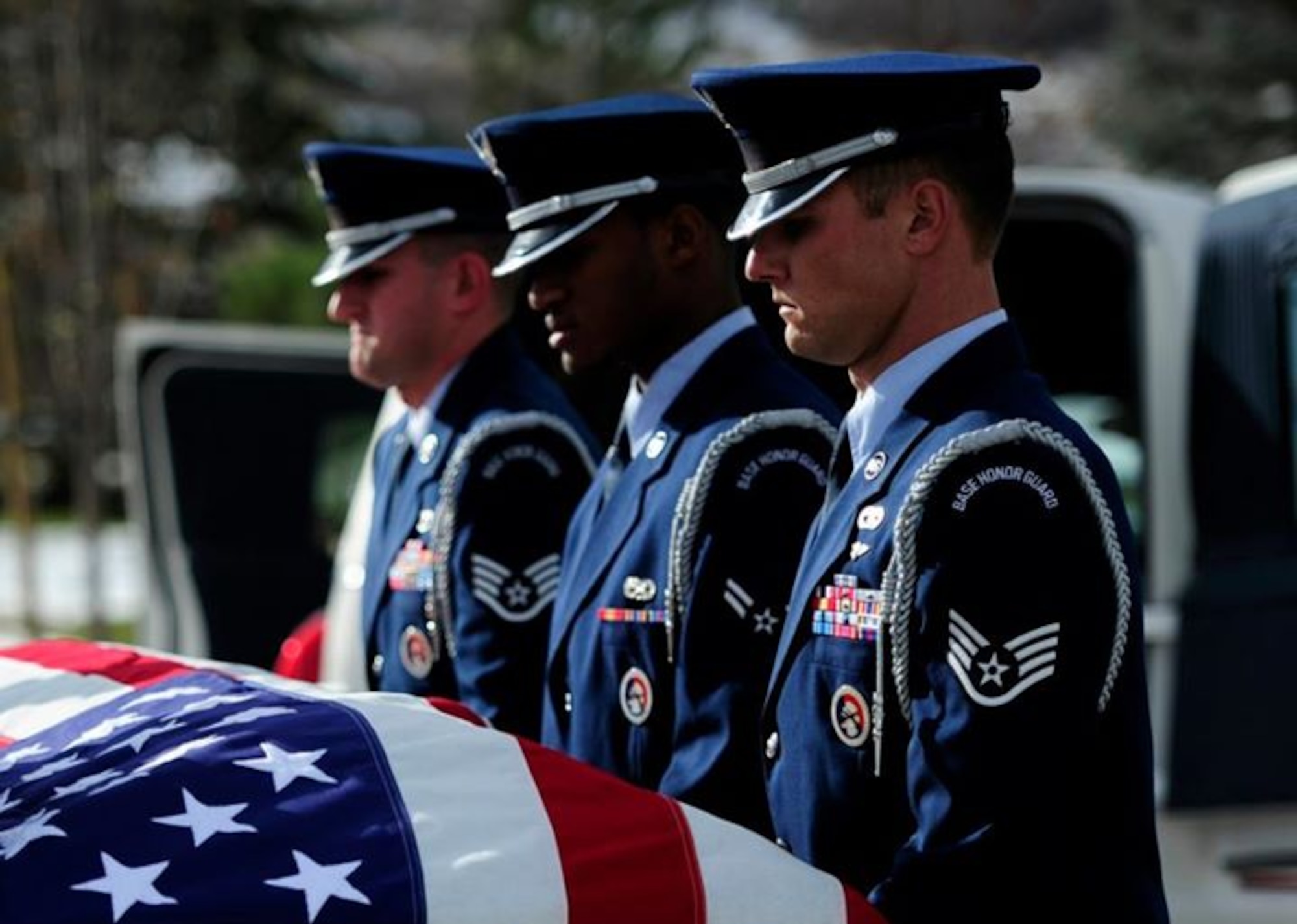The U.S. Hill Air Force Base Honor Guard proceeds a funeral at Veterans Memorial Park, Utah, held for retired U.S. Air Force Master Sgt. Richard Schildknecht, Nov. 15, 2012. The tasks that are carried out by the honor guard during the funeral include the carrying of the casket, folding of the American flag, and a three round volley. The flag and the spent rounds from the volley are given to the deceased's family. (U.S. Air Force photo/Airman 1st Class Justyn M. Freeman)