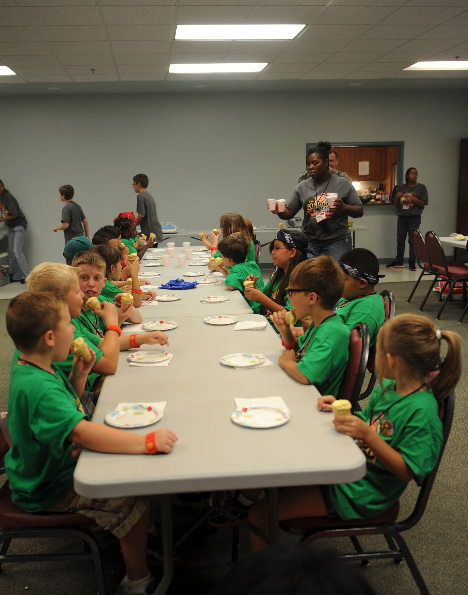 Children sit to enjoy a quick snack during Vacation Bible School (VBS) at Moody Air Force Base, Ga., June 14, 2013.  The base Chapel held VBS for the week of June 10 to14. (U.S. Air Force photo by Airman Alexis Grotz/Released)