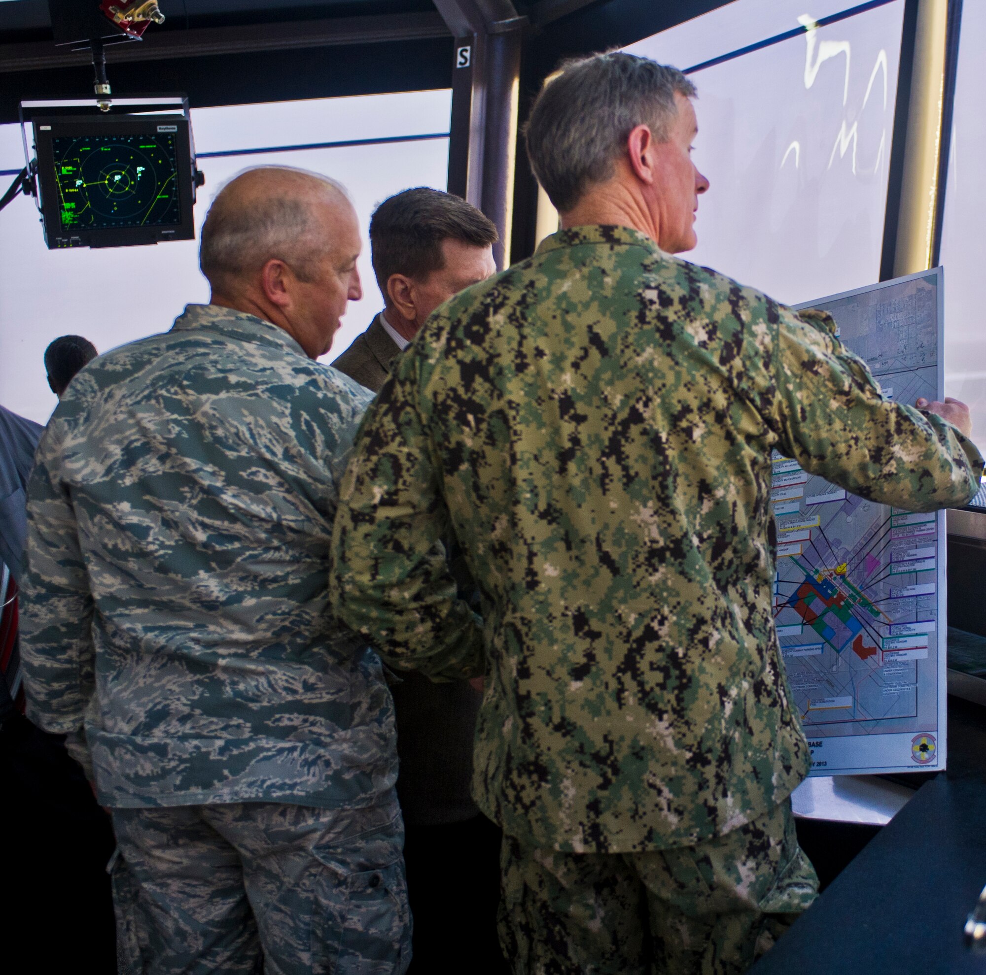 U.S. Navy Adm. William H. McRaven, United States Special Operations Command commander, is briefed by Col. David Piech, 27th Special Operations Mission Support Group commander, about the ongoing construction projects at Cannon Air Force Base, N.M., June 19, 2013. (U.S. Air Force photo/Airman 1st Class Xavier Lockley)
