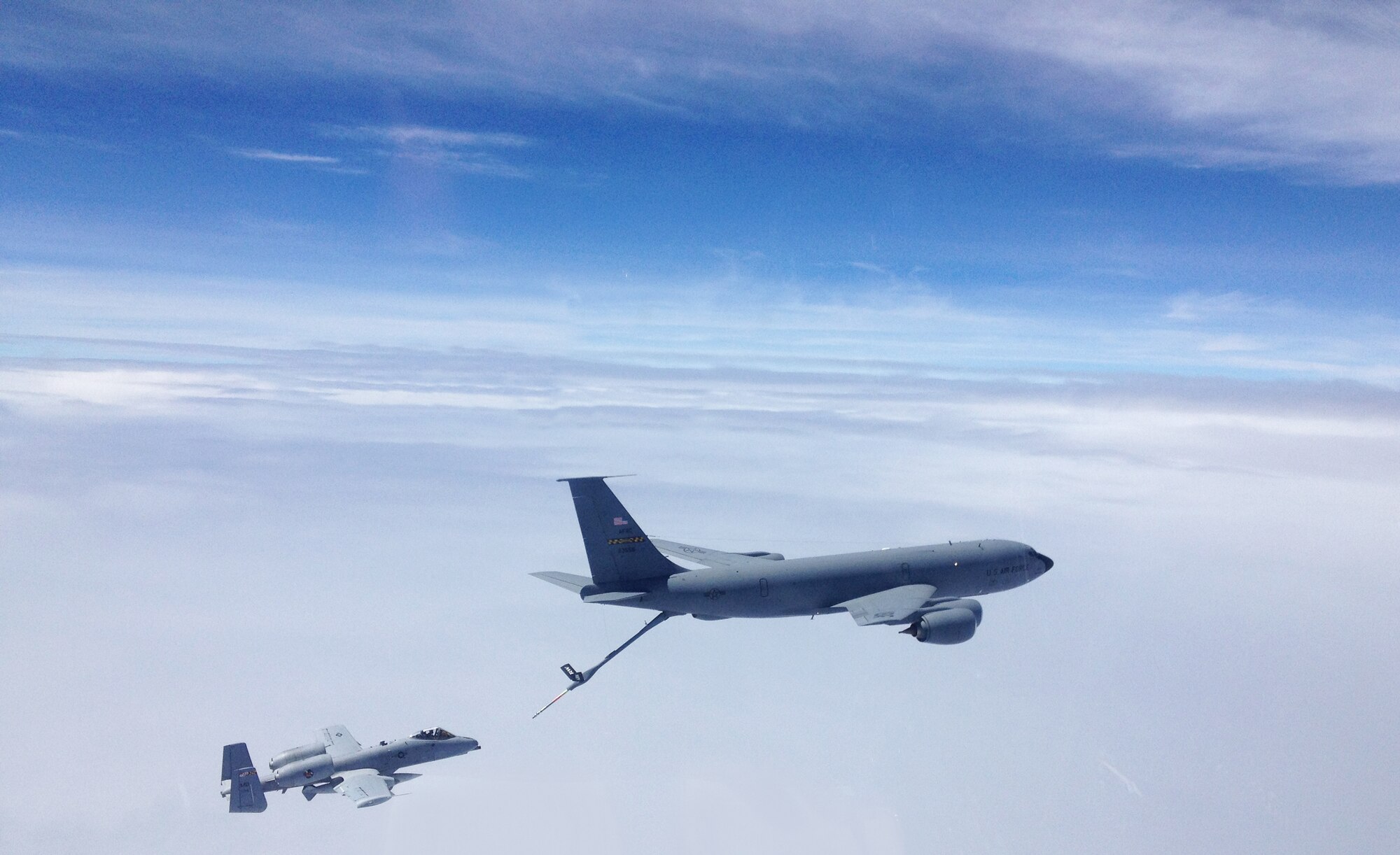 An Air National Guard A-10 Thunderbolt II fighter jet from the 175th Wing, Baltimore, pulls up under the boom, or fuel nozzle, of a KC-135 Stratotanker from the 459th Air Refueling Wing, Joint Base Andrews, Md., during a mission which refueled the A-10s from European countries back to the U.S., June 9, 2013. The crews also partnered with a tanker team from the 22 ARW, McConnell Air Force Base, Kan. All units involved belong to a Total Force Integration. (U.S. Air Force photo/ Lt. Col. Paul Zurkowski)