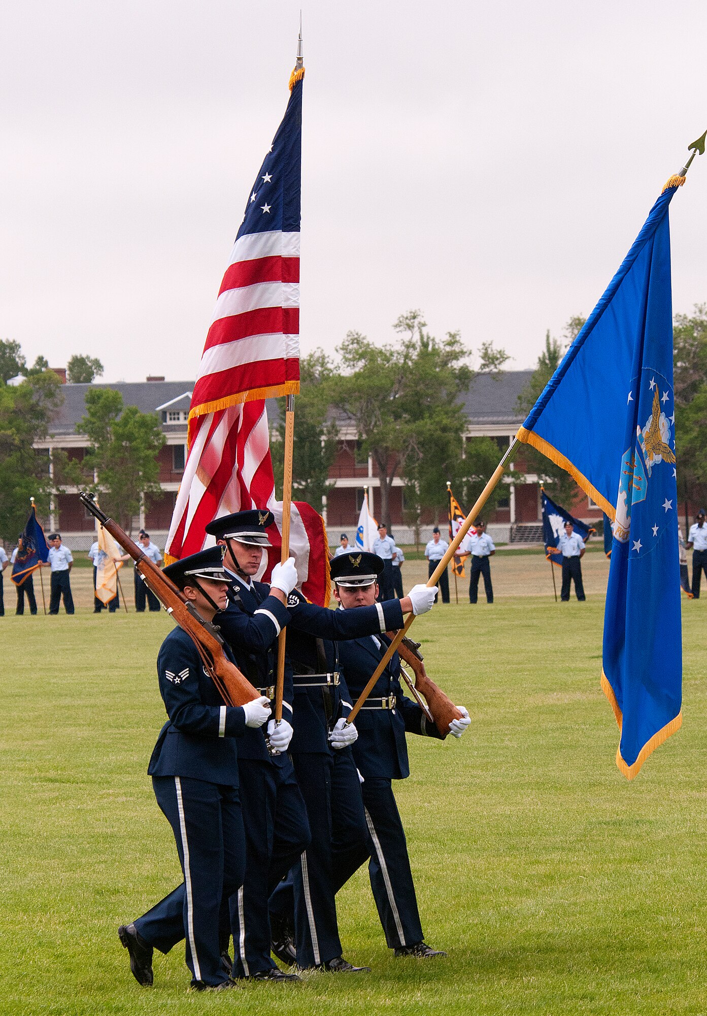 The F. E. Warren Air Force Base Honor Guard takes part in the pass-in-review on Argonne Parade Field during the 90th Missile Wing’s change-of-command ceremony June 17, 2013. Col. Tracey Hayes assumed command of the wing from Col. George Farfour. (U.S. Air Force photo by R.J. Oriez)