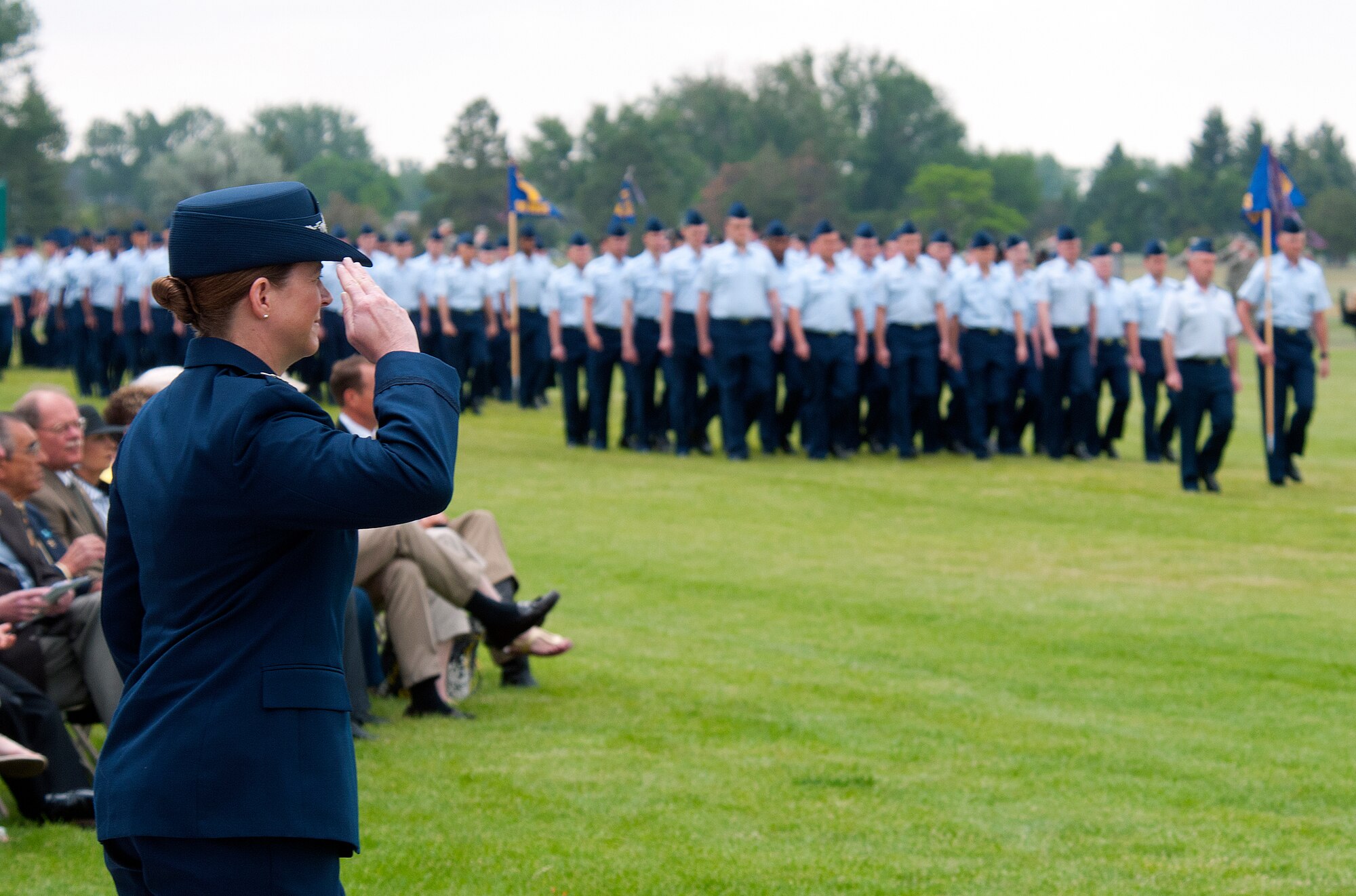 Col. Tracey Hayes, 90th Missile Wing commander, returns a salute as her command passes in review on F. E. Warren Air Force Base’s Argonne Parade Field at the close of the wing’s change-of-command ceremony June 17, 2013. (U.S. Air Force photo by R.J. Oriez)