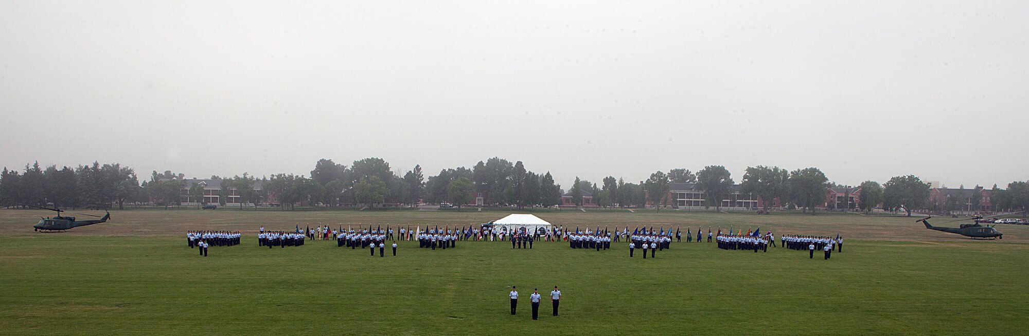 Airmen of the Mighty Ninety formed in squadrons await the 90th Missile Wing Change of Command ceremony during which they marched for a pass-in-review in front of the new 90th MW commander, Col. Tracey Hayes. (U.S. Air Force photo by Matt Bilden)