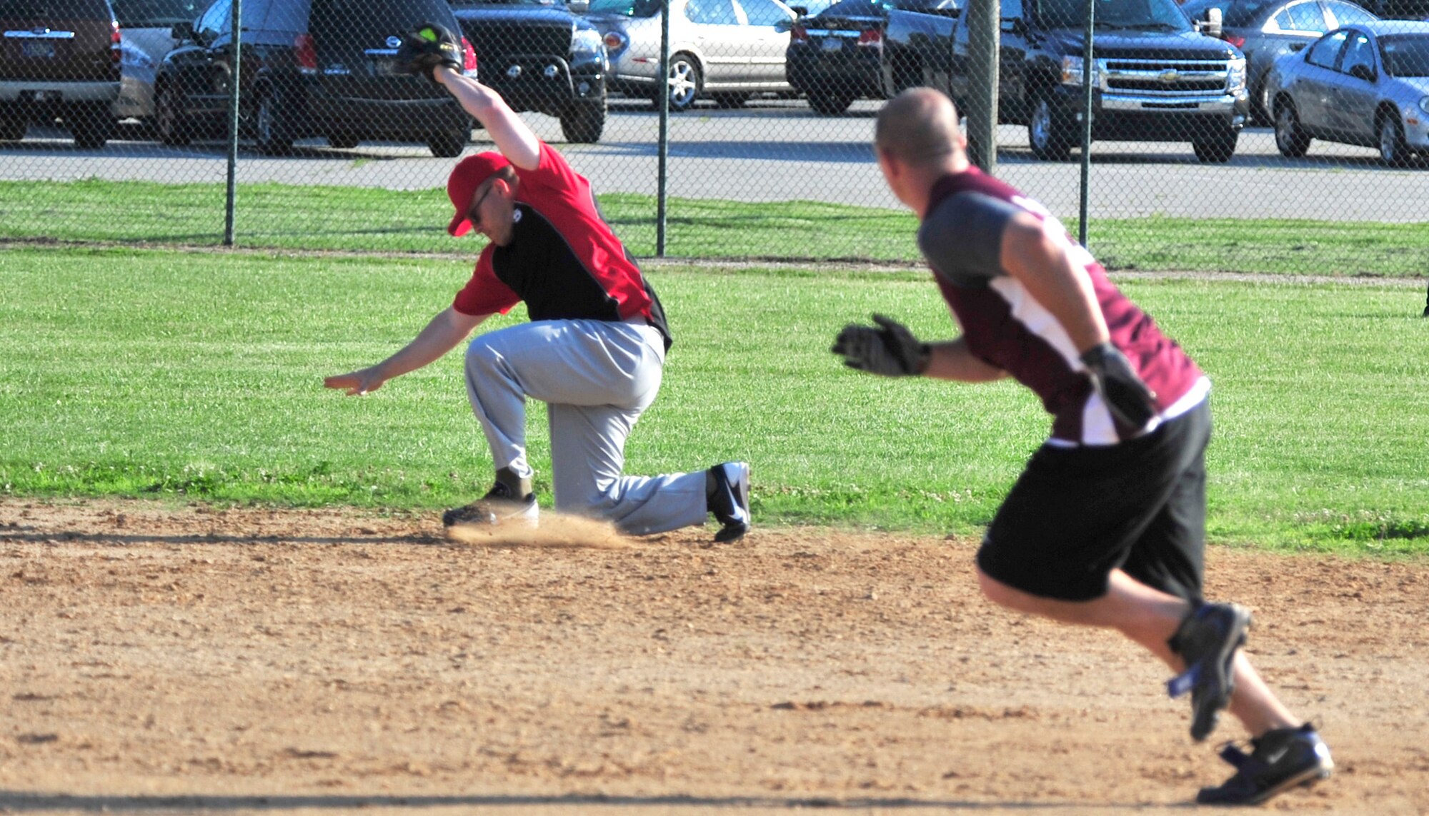 Michael Jobin, 436th Civil Engineer Squadron shortstop, snags a line drive during an intramural softball game June 20, 2013, at Dover Air Force Base, Del. The 436th CES defeated the Air Force Mortuary Affairs Office 16-5 in the first game of the season for both teams. (U.S. Air Force photo/Tech. Sgt. Chuck Walker)