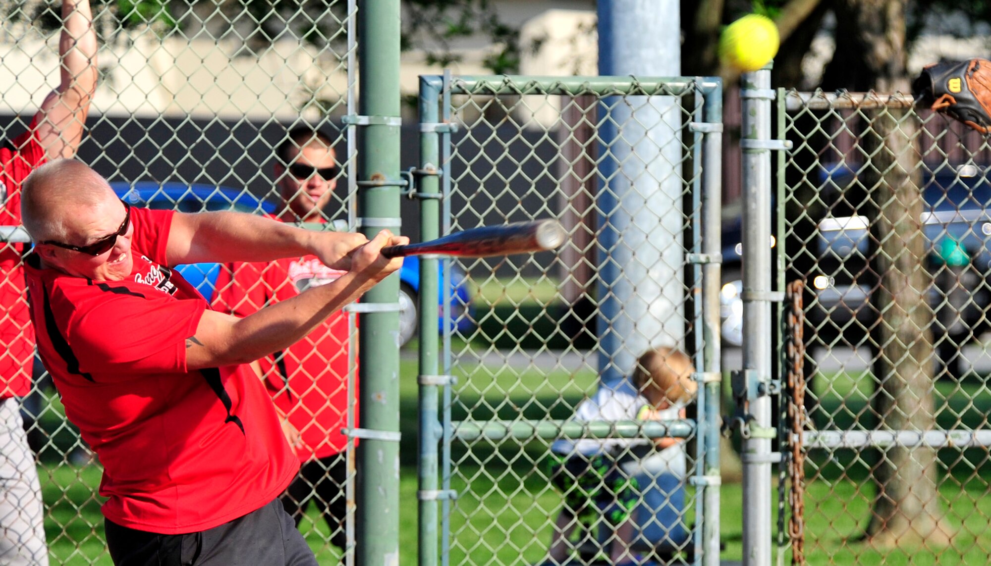 Adam Monoski, 436th Civil Engineer Squadron left fielder, raps a hit during an intramural softball game June 20, 2013, at the softball field on Dover Air Force Base, Del. The 436th CES mercy-ruled the Air Force Mortuary Affairs Office 16-5. (U.S. Air Force photo/Tech. Sgt. Chuck Walker)