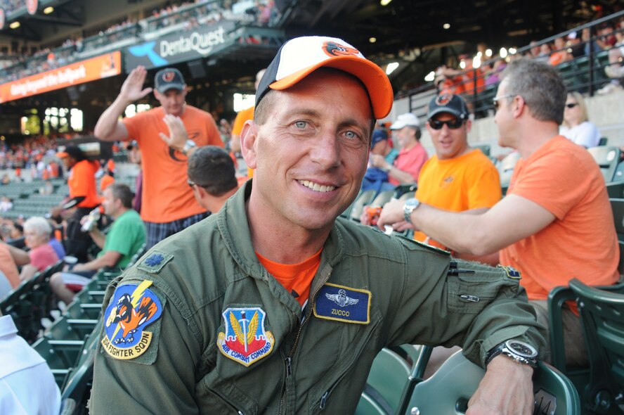 On June 14, 2013, Lt. Col Paul Zurkowski prepares to watch the Baltimore Orioles take on the Boston Red Sox at Oriole Park at Camden Yards in Baltimore, MD.   Before the game, Zurkowski and fellow pilots from the 104th Fighter Squadron at Warfield Air National Guard base presented Dan Duquette, executive vice president of baseball operations Baltimore Orioles, with a flag flown during a combat mission.  (Air National Guard photo by Tech. Sgt. David Speicher/Released)