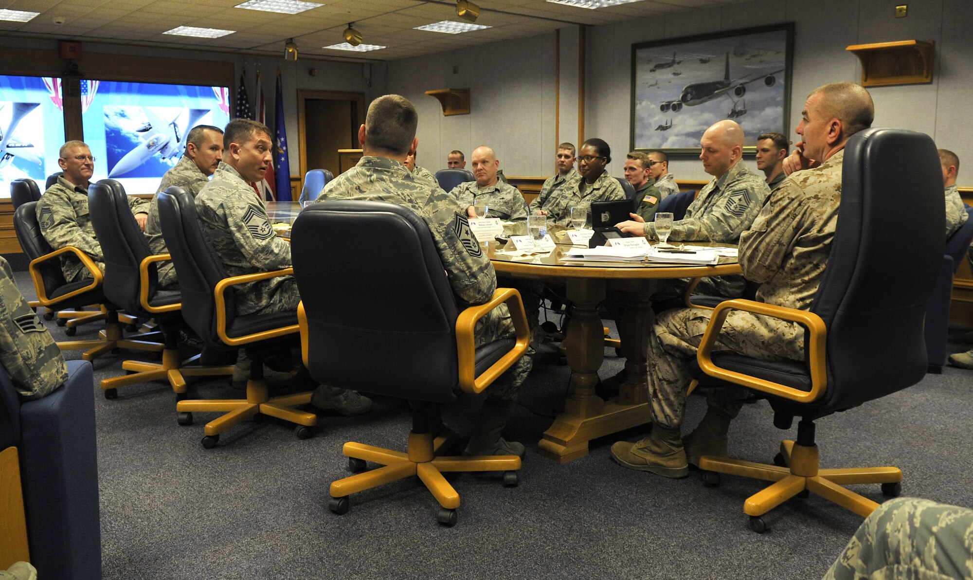 U.S. Marine Corps Sgt. Maj. Bryan Battaglia, senior enlisted advisor to the Chairman of the Joint Chiefs of Staff, speaks to enlisted Airmen during a Team Mildenhall mission brief June 20, 2013, on RAF Mildenhall, England. During his visit, Battaglia toured 352nd Special Operations Group assets as well as a KC-135 Stratotanker. (U.S. Air Force photo by Staff Sgt. Jerilyn Quintanilla/Released)