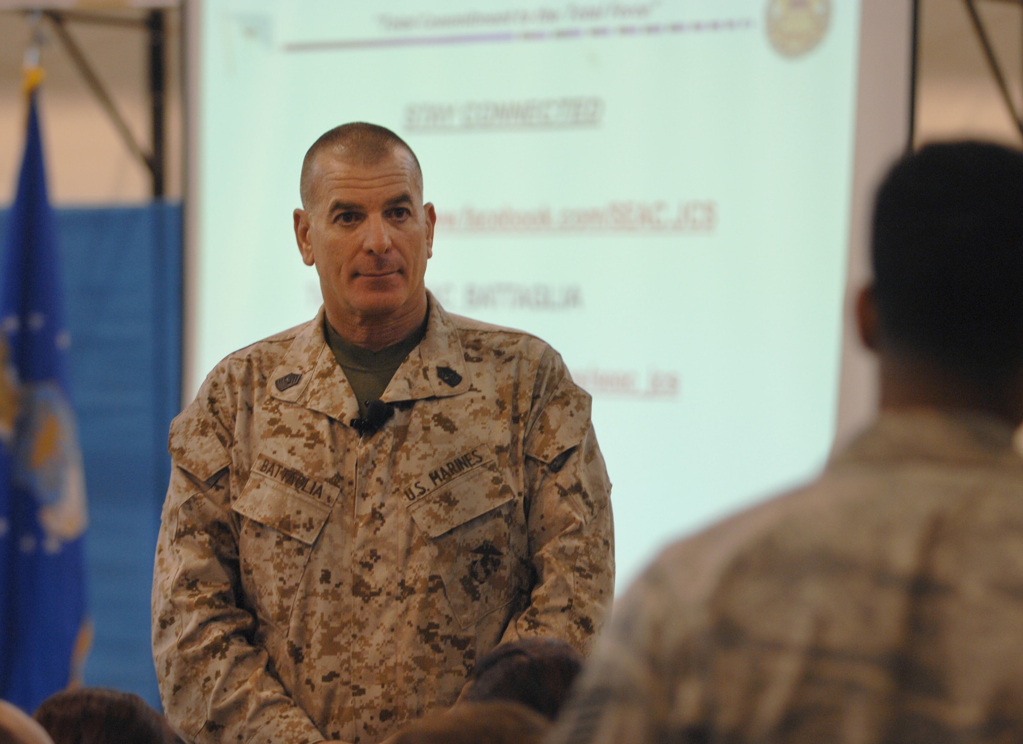 U.S. Marine Corps Sgt. Maj. Bryan Battaglia, senior enlisted advisor to the Chairman of the Joint Chiefs of Staff, answers a question from a Team Mildenhall Airman June 20, 2013, during a base town hall meeting at the Hardstand Fitness Center on RAF Mildenhall, England. Battaglia answered questions about sexual assault, leadership and military readiness. (U.S. Air Force photo by Airman 1st Class Dillon Johnston/Released)