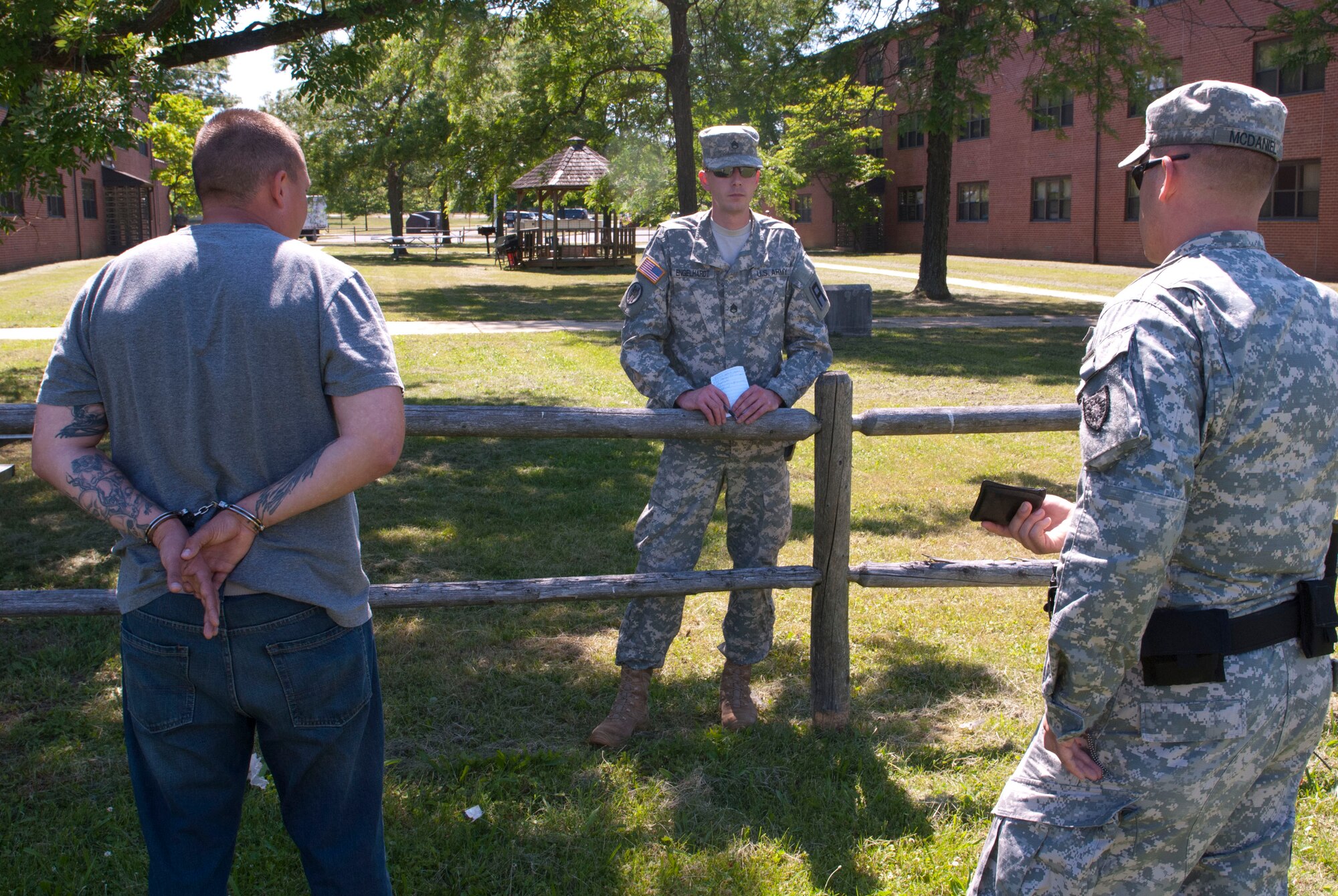 Staff Sgt. David Engelhardt, 1st Infantry Battalion, 307th Infantry Regiment, 174th Infantry Brigade, First Army Division East trainer/mentor, evaluates investigation and apprehension skills during mission-specific training for the 1103rd Military Police Detachment, Kentucky Army National Guard, at Joint Base McGuire-Dix-Lakehurst, N.J., June 5, 2013. (U.S. Army photo by Sgt. 1st Class Stan Maszczak/Released)