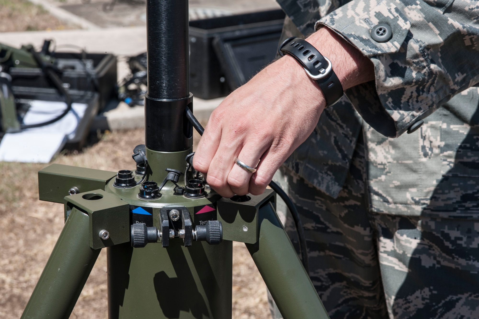 Staff Sgt. Michael Beckner, 39th Operations Squadron weather technician, assembles parts of a tactical meteorological equipment tower June 21, 2013, at Incirlik Air Base, Turkey. The tower tracks items such as wind speed, cloud cover, precipitation and temperature. (U.S. Air Force photo by Senior Airman Anthony Sanchelli/Released)
