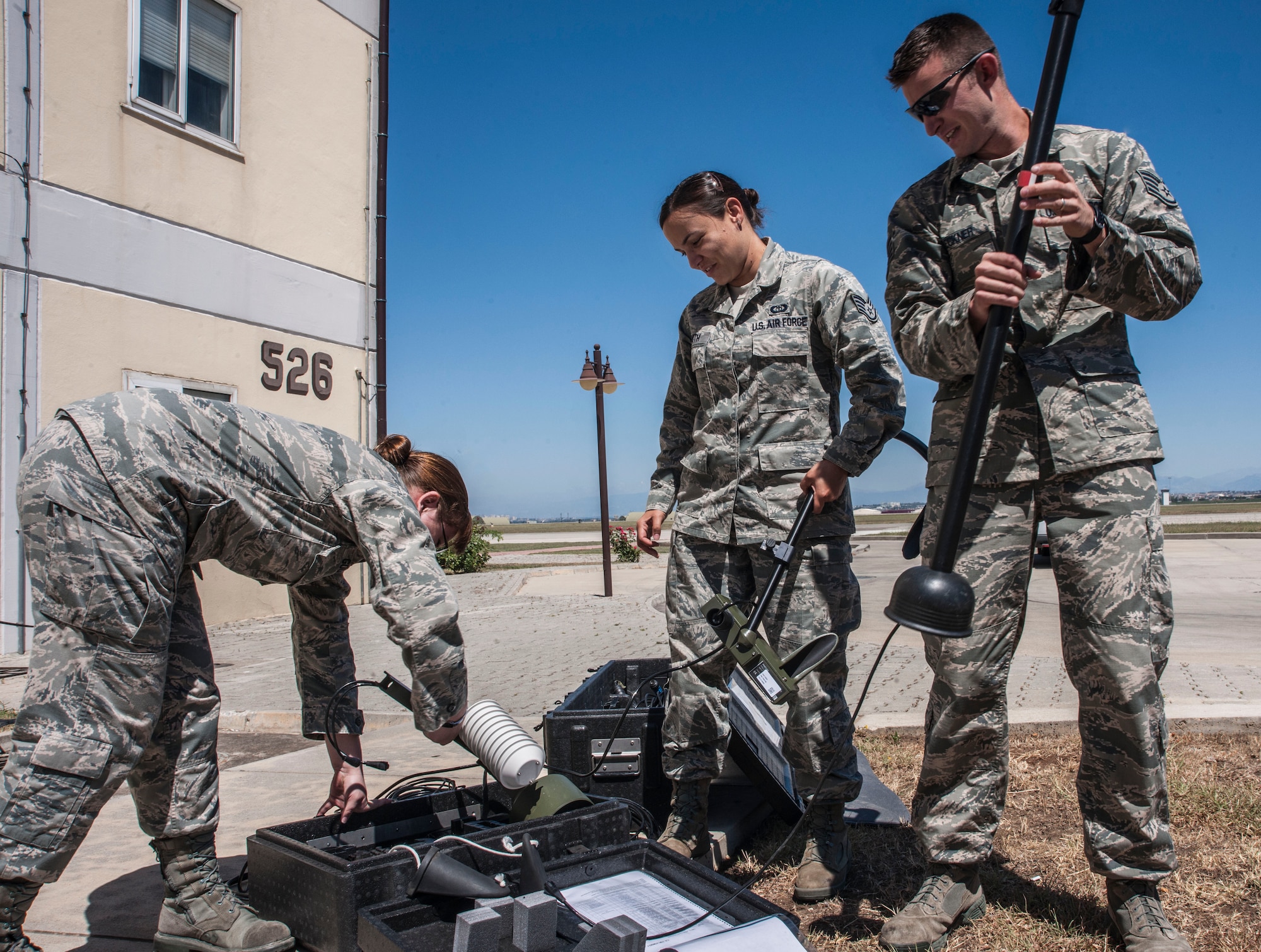 Staff Sgts. Elizabeth Goodwin, Natasha Smith and Michael Beckner, 39th Operations Squadron weather technicians, assemble a tactical meteorological equipment tower June 21, 2013, at Incirlik Air Base, Turkey. The tower is just one piece of equipment the weather flight uses to track weather patterns. (U.S. Air Force photo by Senior Airman Anthony Sanchelli/Released)
