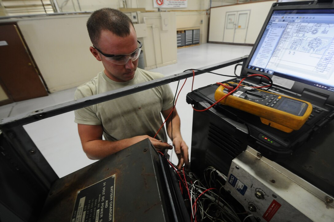 Senior Airman Scott Brown, 36th Aerospace Ground Equipment maintenance technician, uses a multimeter to ensure the wiring is going to the right location June 19, 2013, on Andersen Air Force Base, Guam. The maintenance technicians inspect, test and operate AGE to determine equipment serviceability and proper operation. (U.S. Air Force photo by Airman 1st Class Emily A. Bradley/Released)