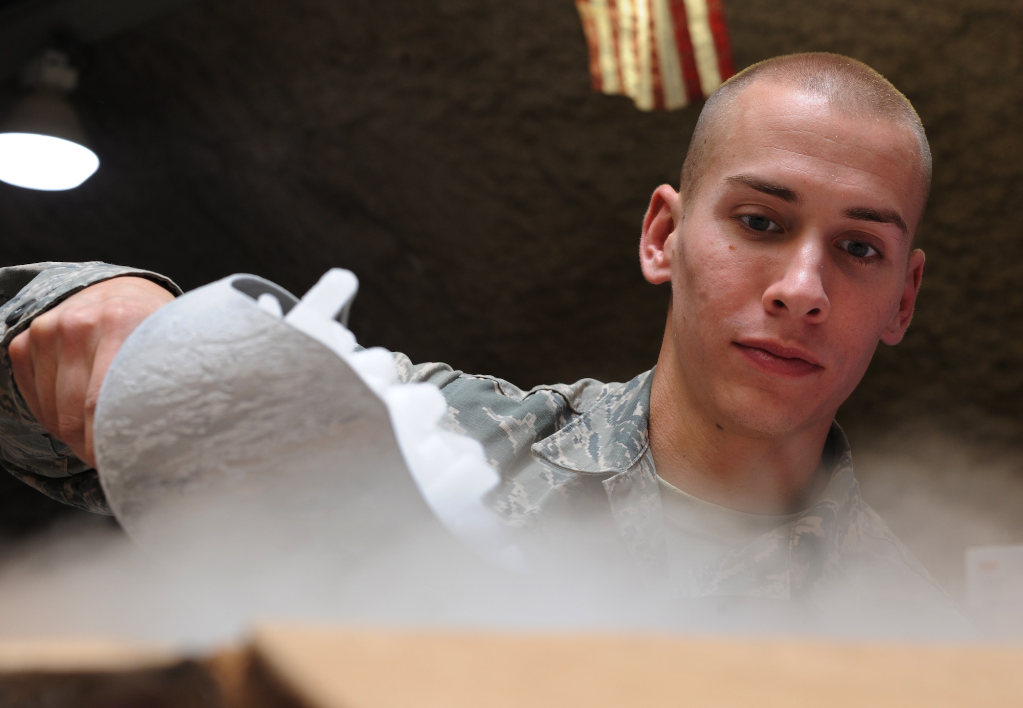 Senior Airman Travis Exner fills a box with dry ice to be shipped to Afghanistan at the379th Air Expeditionary Wing’s Blood Transshipment Center in Southwest Asia, June 13, 2013. In addition to blood products, the BTC is the sole provider of dry ice to various locations within the area of responsibility. Exner is a 379th Expeditionary Medical Support Squadron BTC logistics technician deployed from Eglin Air Force Base, Fla. (U.S. Air Force photo/Senior Airman Bahja J. Jones)