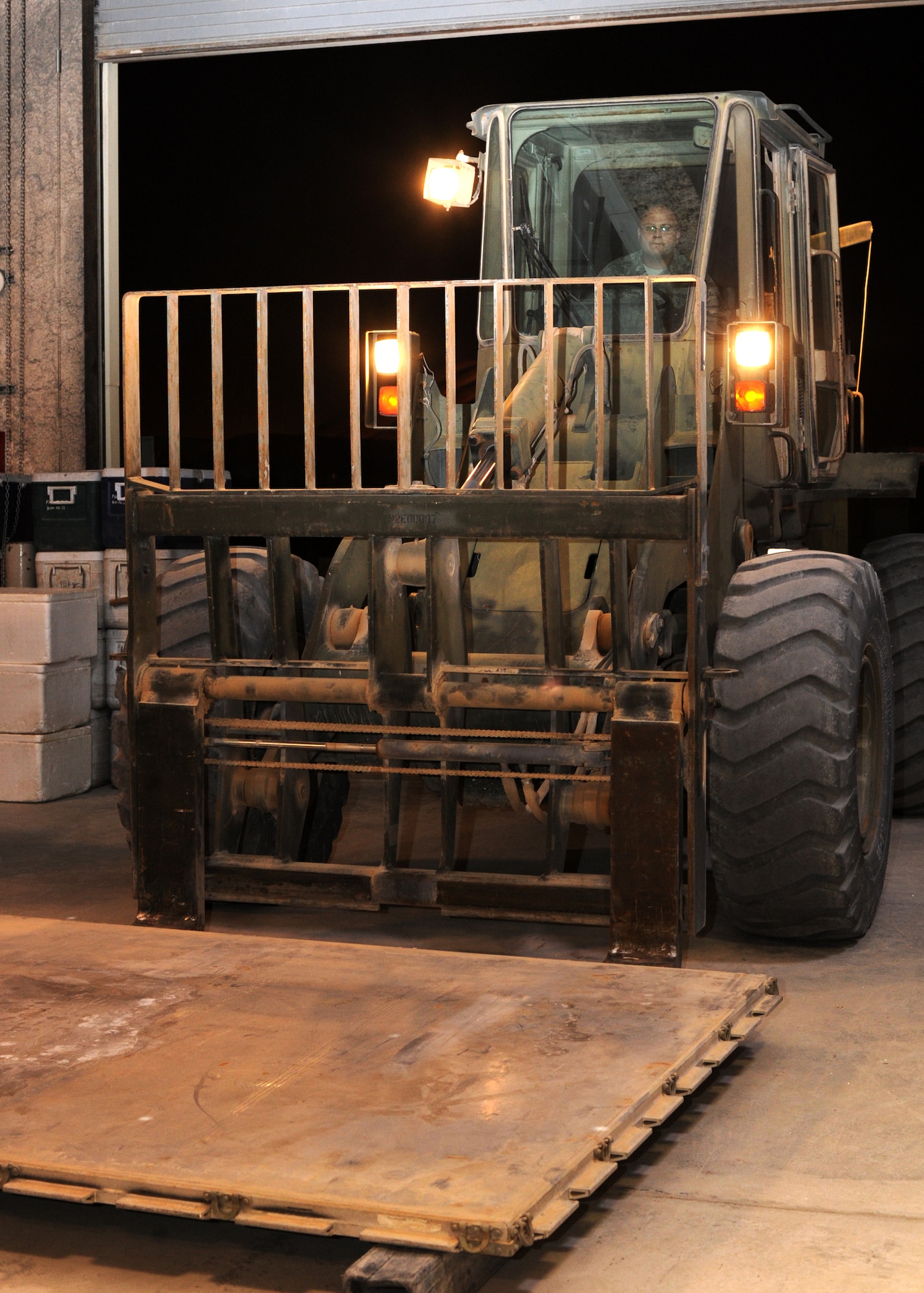 Staff Sgt. Aaron Gerasch uses a forklift to place a pallet inside the 379th Air Expeditionary Wing’s Blood Transshipment Center in Southwest Asia, June 13, 2013. Blood products and dry ice are loaded onto the pallets for distribution throughout the area of responsibility. Gerasch is the 379th Expeditionary Medical Support Squadron BTC NCO in charge deployed from Eglin Air Force Base, Fla. (U.S. Air Force photo/Senior Airman Bahja J. Jones) 