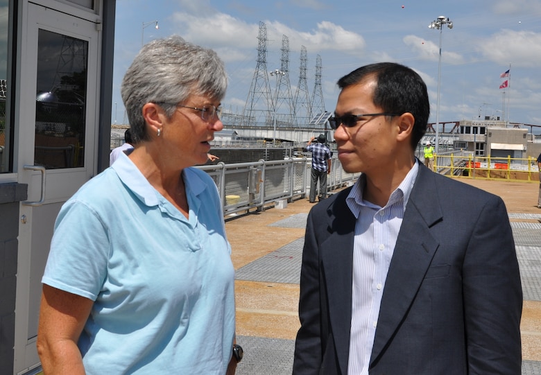 Patty Coffey, left, U.S. Army Corps of Engineers Nashville District, Operations Division deputy chief, answers questions from Anoulak Kittikhoun, Lao PDR, Mekong River Commission Secretariat during the MRC’s June 18, 2013 visit to the Kentucky Lock Addition project, Grand Rivers, Ky.