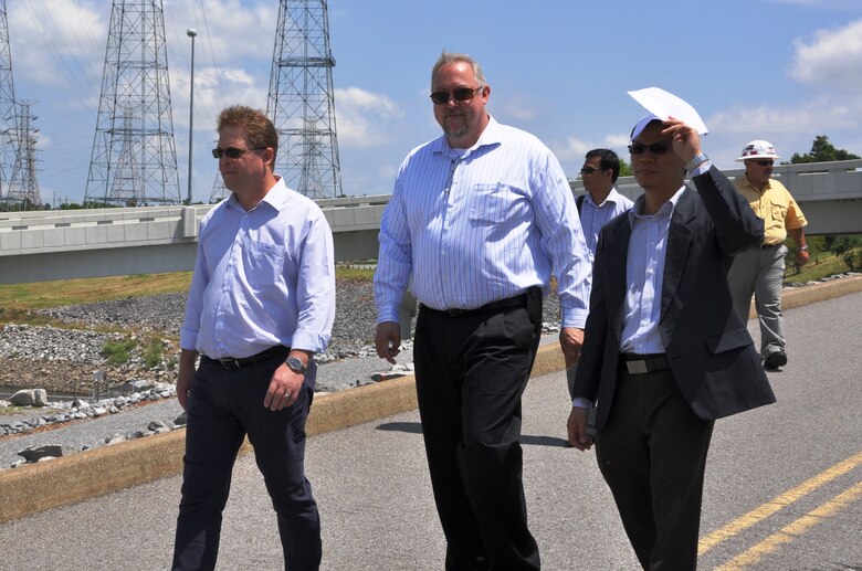 Rich Hancock, center, U.S. Army Corps of Engineers, director of Great Lakes and Ohio River Division’s Regional Business Directorate leads members of the Mekong River Commission on a tour of Kentucky Dam’s Powerhouse Island during their June 18, 2013 visit. Others from left are Hans Guttman, Sweden; Tong Ngoc Thanh, Vietnam (behind Hancock); Anoulak Kittikhoun, LAO PDR; and Mark Abshire, wearing helmet, Nashville District lockmaster of Kentucky and Barkley navigation locks.