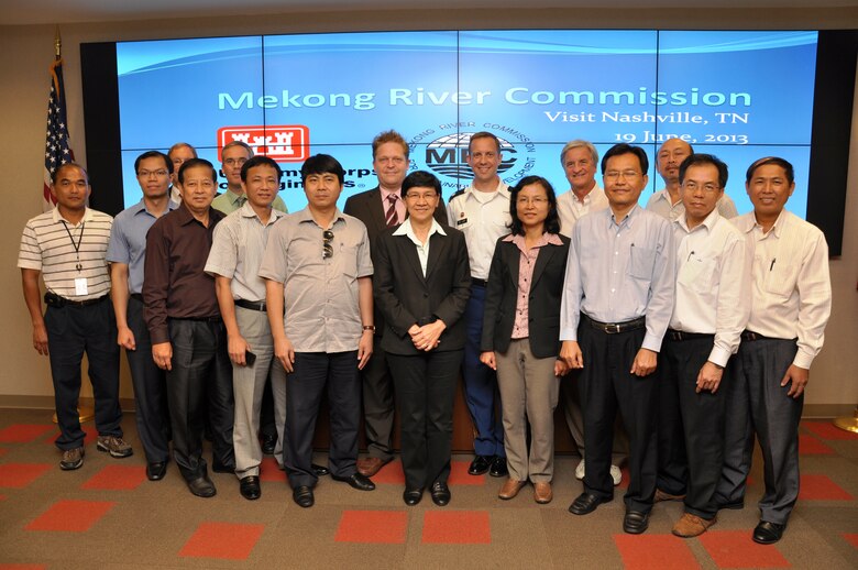 : Members of the Mekong River Commission pose for a photo during their June 19, 2013 briefing at the U.S. Army Corps of Engineers’ Nashville District headquarters. From left, Sovireak In, structural engineer, Nashville District Engineering and Construction Division; Anoulak Kittikhoun, Lao PDR; Mike Wilson, partially hidden, District deputy for Programs and Project Management; Chanthachith Amphaychith, Lao PDR; Ben Rohrbach, chief, District hydrology and Hydraulics Branch; Tong Ngoc Thanh, Vietnam; Hoang Minh Toan, Vietnam; Hans Guttman, Sweden; Ms. Pakawan Chufamanee, Thailand; Lt. Col. James A. DeLapp, Nashville District commander; Ms. Ruamporn Ngamboriarak, Thailand; John Emmerson, USACE Pacific Division project manager; Satit Phiromchai, Thailand; Voradeth Phonekeo, Lao PDR; Dr. Davong Phonekeo, Lao PDR; and SOK Khom, Cambodia