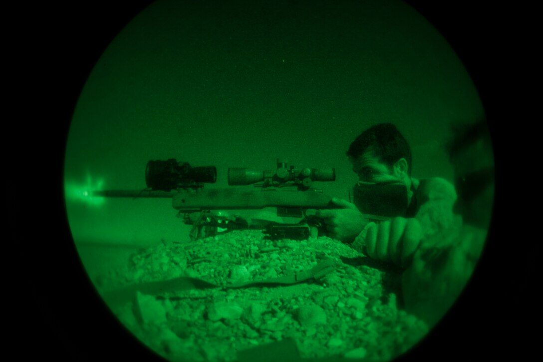 U.S. Navy hospitalman second class Michael Conti, a special amphibious reconnaissance corpsman assigned to 26th Marine Expeditionary Unit (MEU) Maritime Raid Force, fires an M40 sniper rifle during a nighttime live fire in Jordan, June 21, 2013. Exercise Eager Lion 2013 is an annual, multinational exercise designed to strengthen military-to-military relationships and enhance security and stability in the region by responding to modern-day security scenarios. The 26th MEU is a Marine Air-Ground Task Force forward-deployed to the U.S. 5th Fleet area of responsibility aboard the Kearsarge Amphibious Ready Group serving as a sea-based, expeditionary crisis response force capable of conducting amphibious operations across the full range of military operations. (U.S. Marine Corps photograph by Sgt. Christopher Q. Stone, 26th MEU Combat Camera/Released)