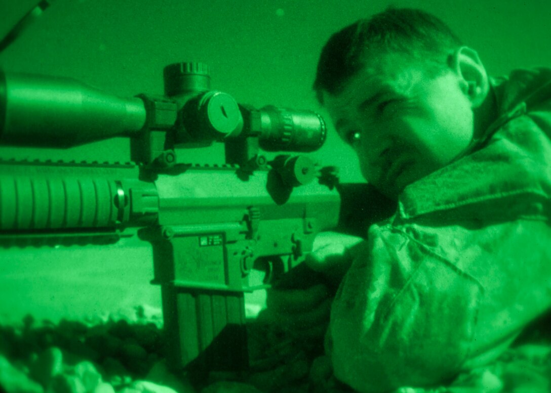 A 26th Marine Expeditionary Unit (MEU) Maritime Raid Force Marine fires an M110 Semi-Automatic Sniper System during a nighttime live fire in Jordan, June 21, 2013. Exercise Eager Lion 2013 is an annual, multinational exercise designed to strengthen military-to-military relationships and enhance security and stability in the region by responding to modern-day security scenarios. The 26th MEU is a Marine Air-Ground Task Force forward-deployed to the U.S. 5th Fleet area of responsibility aboard the Kearsarge Amphibious Ready Group serving as a sea-based, expeditionary crisis response force capable of conducting amphibious operations across the full range of military operations. (U.S. Marine Corps photograph by Sgt. Christopher Q. Stone, 26th MEU Combat Camera/Released)