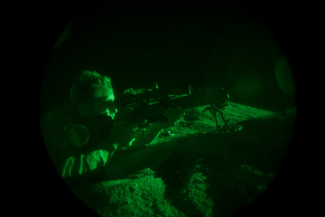 A 26th Marine Expeditionary Unit (MEU) Maritime Raid Force Marine fires an M40 sniper rifle during a nighttime live fire in Jordan, June 21, 2013. Exercise Eager Lion 2013 is an annual, multinational exercise designed to strengthen military-to-military relationships and enhance security and stability in the region by responding to modern-day security scenarios. The 26th MEU is a Marine Air-Ground Task Force forward-deployed to the U.S. 5th Fleet area of responsibility aboard the Kearsarge Amphibious Ready Group serving as a sea-based, expeditionary crisis response force capable of conducting amphibious operations across the full range of military operations. (U.S. Marine Corps photograph by Sgt. Christopher Q. Stone, 26th MEU Combat Camera/Released)