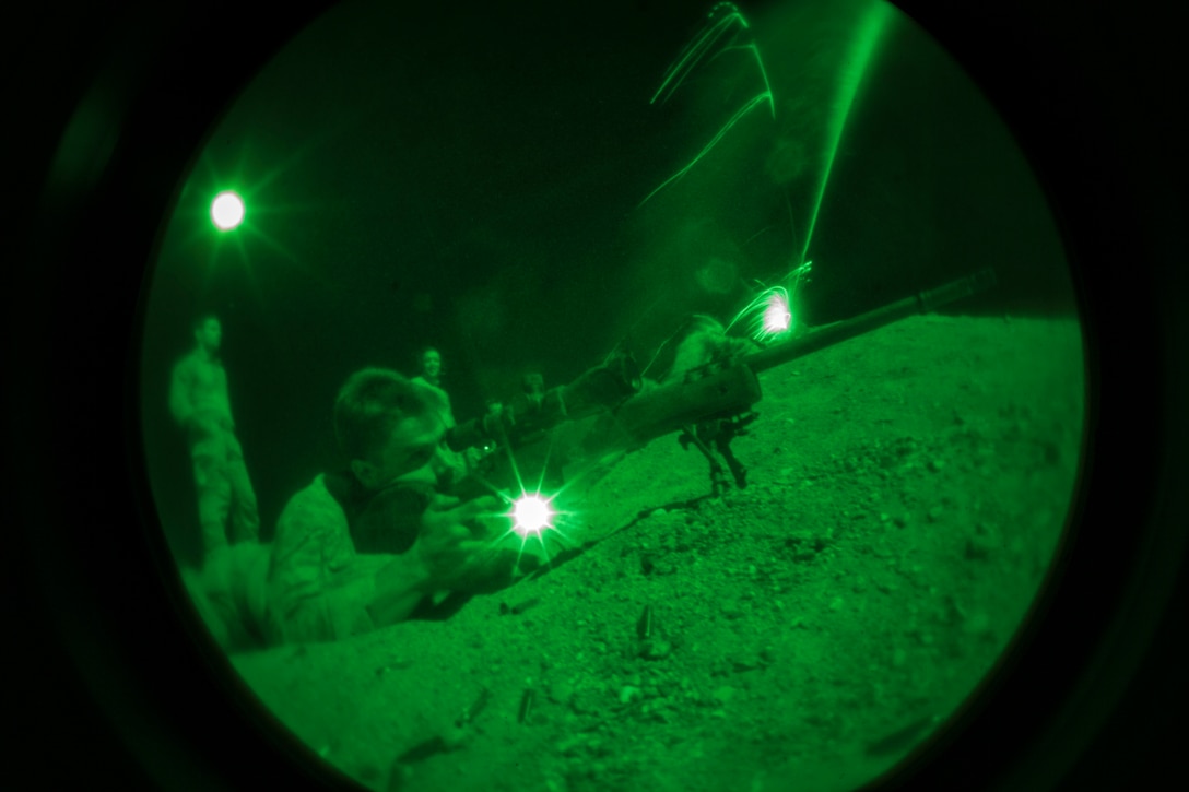 A 26th Marine Expeditionary Unit (MEU) Maritime Raid Force Marine fires an M40 sniper rifle during a nighttime live fire in Jordan, June 21, 2013. Exercise Eager Lion 2013 is an annual, multinational exercise designed to strengthen military-to-military relationships and enhance security and stability in the region by responding to modern-day security scenarios. The 26th MEU is a Marine Air-Ground Task Force forward-deployed to the U.S. 5th Fleet area of responsibility aboard the Kearsarge Amphibious Ready Group serving as a sea-based, expeditionary crisis response force capable of conducting amphibious operations across the full range of military operations. (U.S. Marine Corps photograph by Sgt. Christopher Q. Stone, 26th MEU Combat Camera/Released)