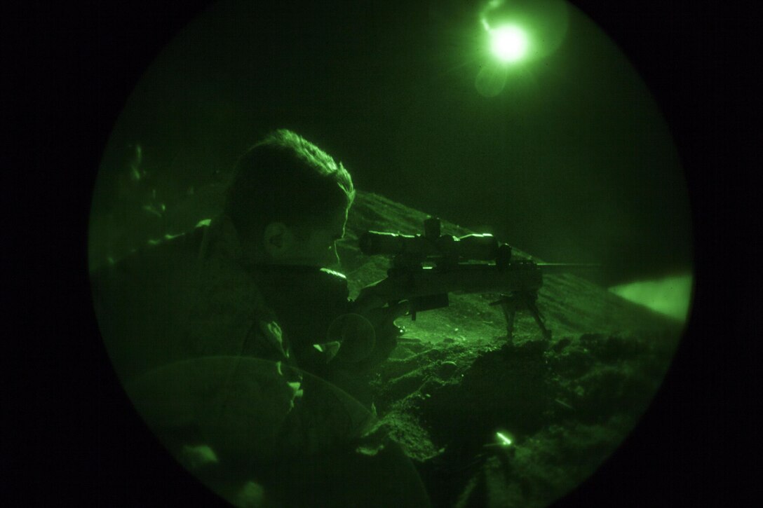 A 26th Marine Expeditionary Unit (MEU) Maritime Raid Force Marine fires an M40 sniper rifle during a nighttime live fire in Jordan, June 21, 2013. Exercise Eager Lion 2013 is an annual, multinational exercise designed to strengthen military-to-military relationships and enhance security and stability in the region by responding to modern-day security scenarios. The 26th MEU is a Marine Air-Ground Task Force forward-deployed to the U.S. 5th Fleet area of responsibility aboard the Kearsarge Amphibious Ready Group serving as a sea-based, expeditionary crisis response force capable of conducting amphibious operations across the full range of military operations. (U.S. Marine Corps photograph by Sgt. Christopher Q. Stone, 26th MEU Combat Camera/Released)