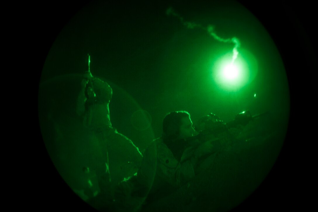A 26th Marine Expeditionary Unit (MEU) Maritime Raid Force Marine fires an M4 carbine during a nighttime live fire in Jordan, June 21, 2013. Exercise Eager Lion 2013 is an annual, multinational exercise designed to strengthen military-to-military relationships and enhance security and stability in the region by responding to modern-day security scenarios. The 26th MEU is a Marine Air-Ground Task Force forward-deployed to the U.S. 5th Fleet area of responsibility aboard the Kearsarge Amphibious Ready Group serving as a sea-based, expeditionary crisis response force capable of conducting amphibious operations across the full range of military operations. (U.S. Marine Corps photograph by Sgt. Christopher Q. Stone, 26th MEU Combat Camera/Released)